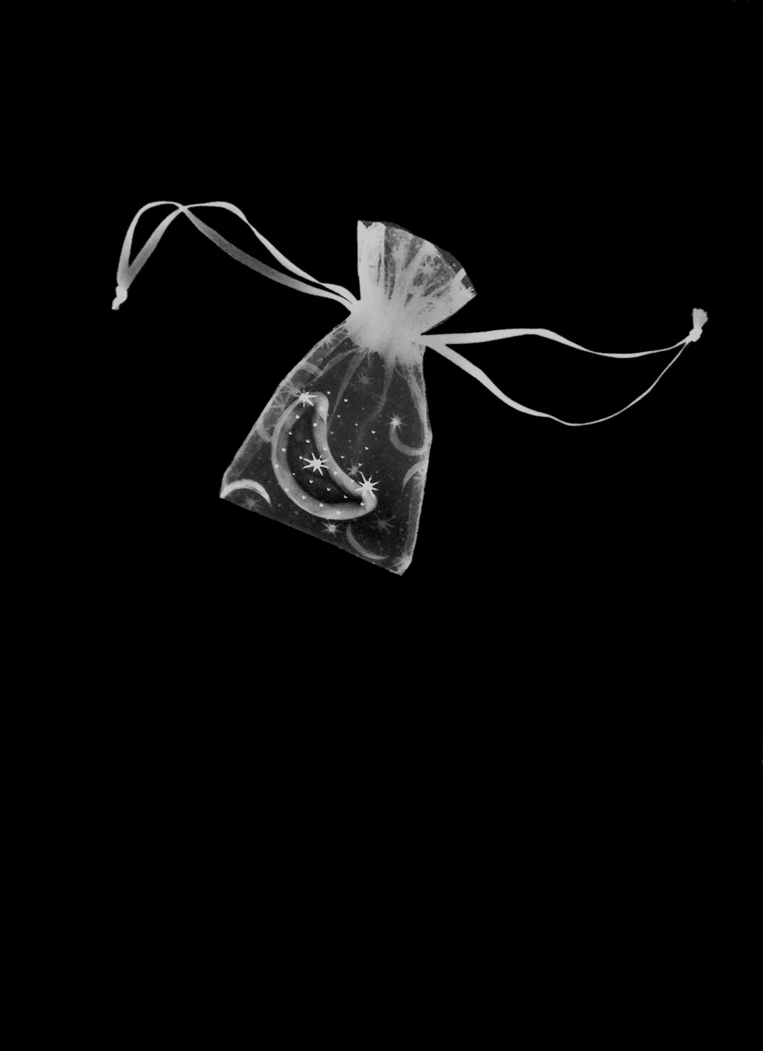 She Carries the Moon and the Stars in a Little Cloth Bag , photogram