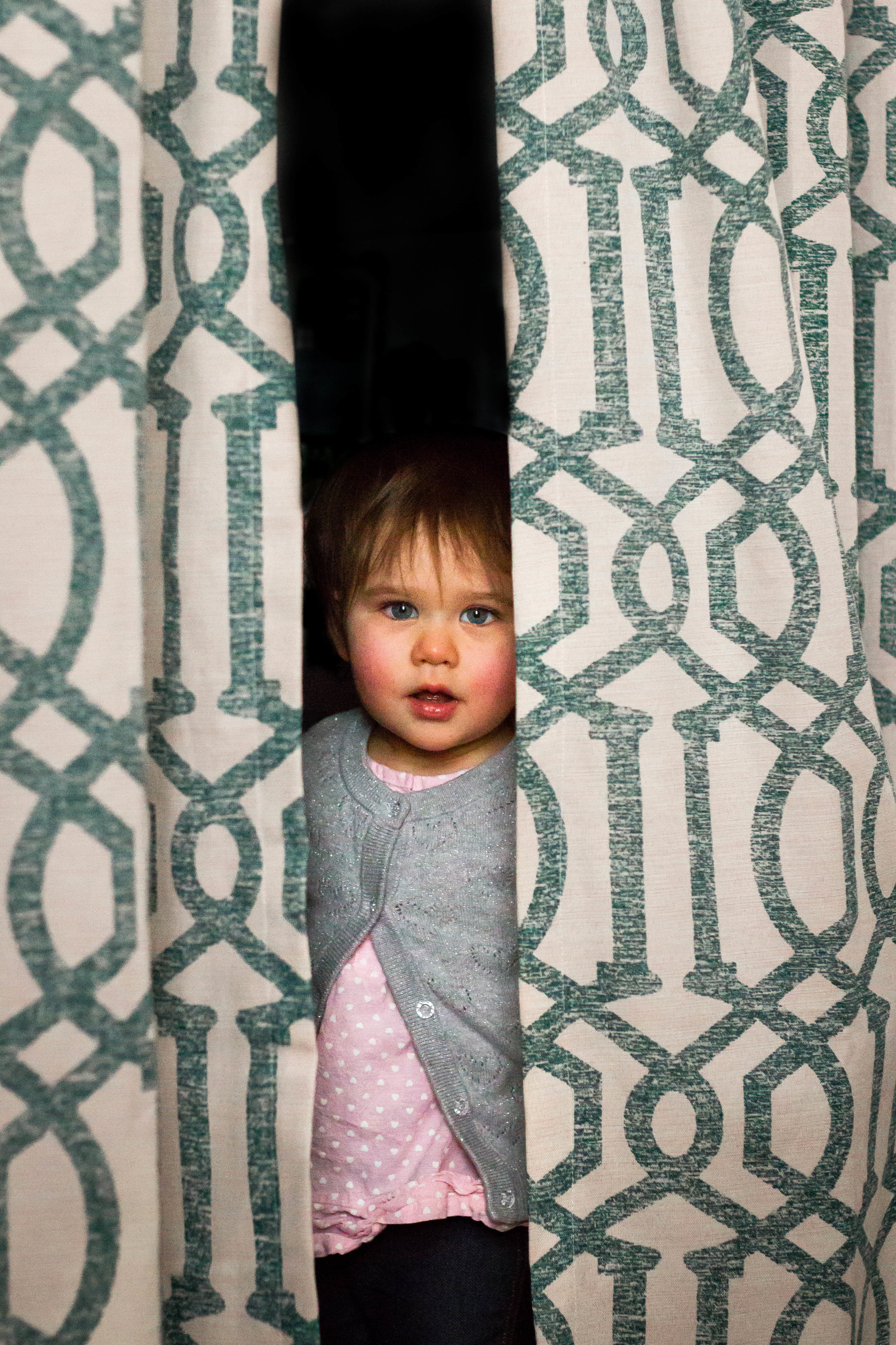 I love when she plays in the closet and peeks out between the curtain panels!