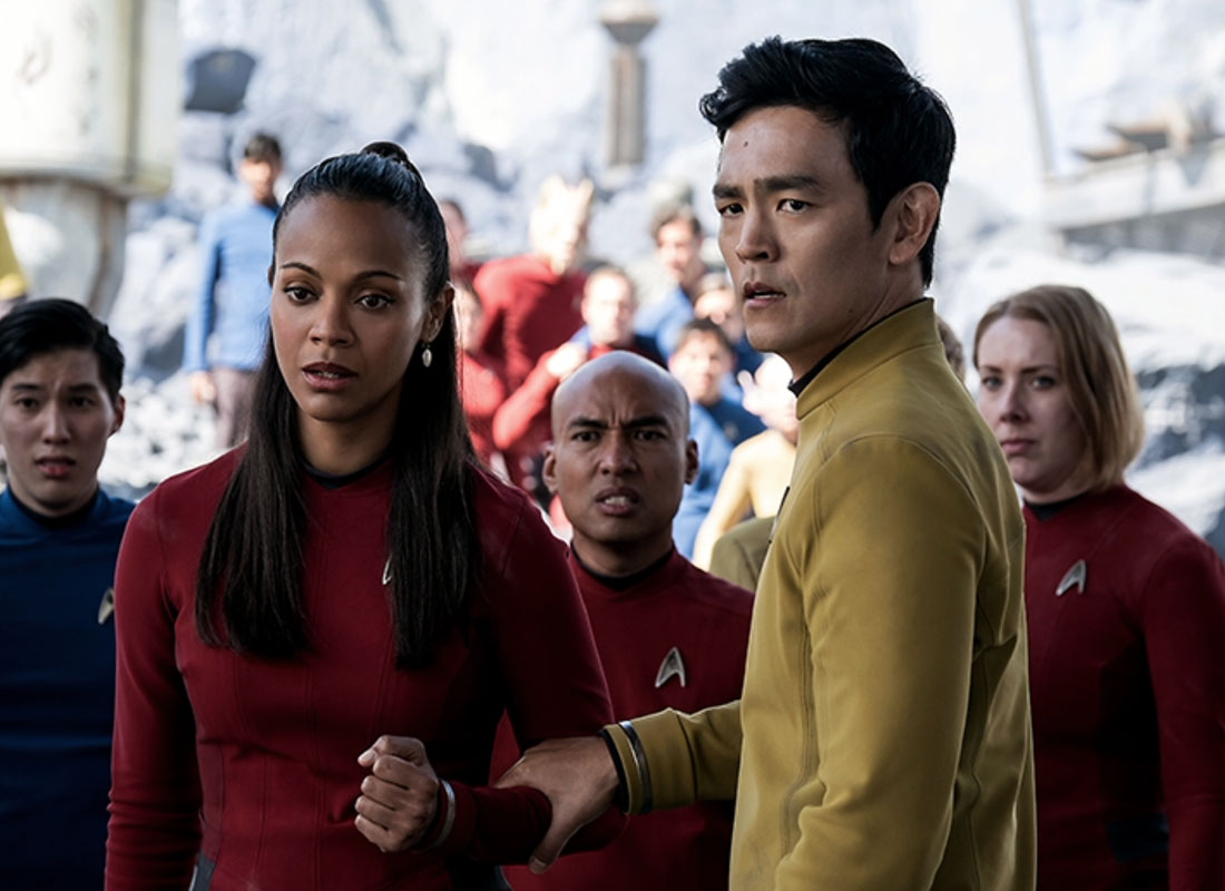 Zoe Saldana (left) as Lieutenant Nyota Uhura and John Cho (right) as Helmsman Hikaru Sulu act like they've been playing these roles for years now. Seven years to be exact. 