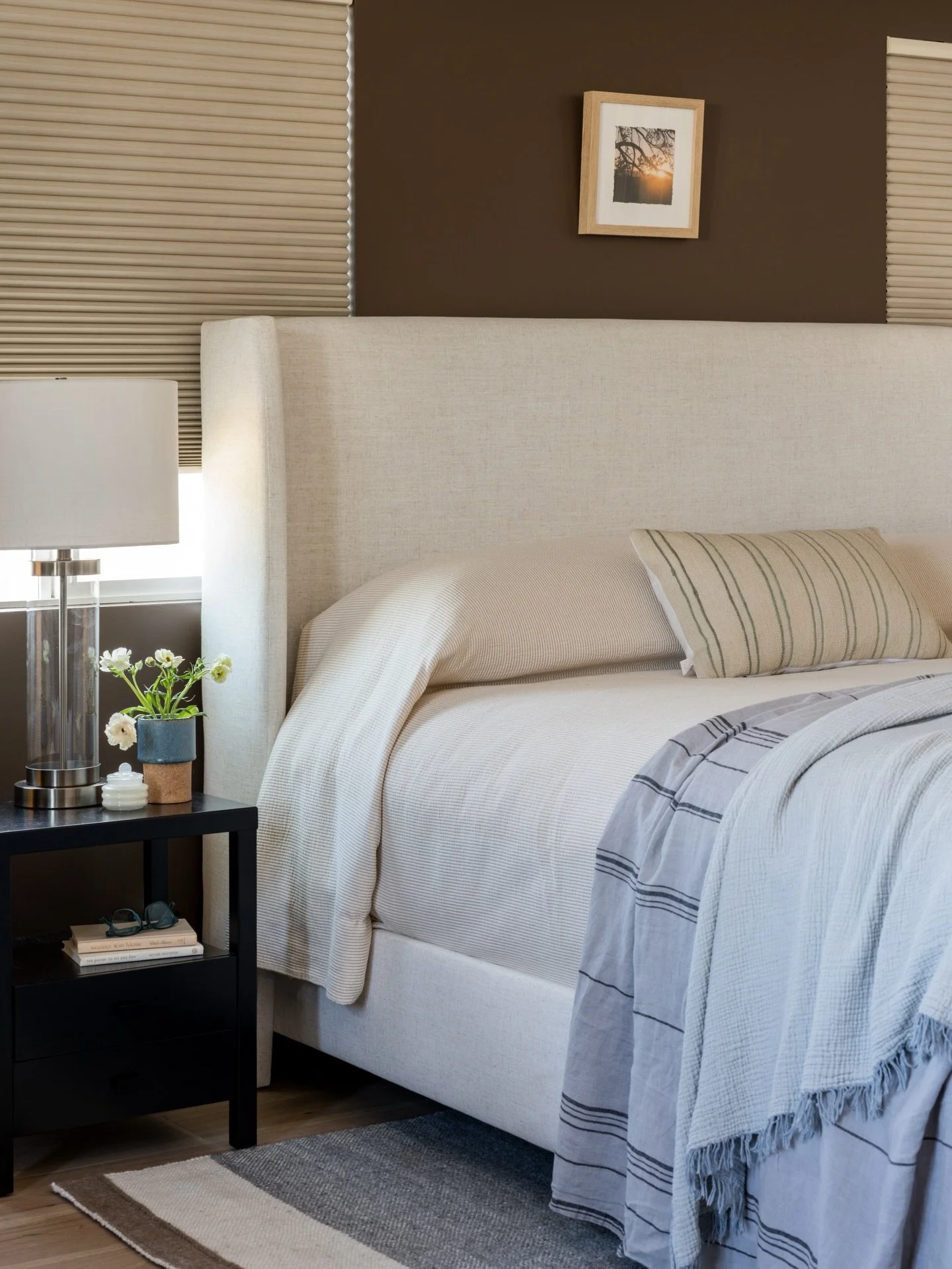 To dial up the cozy-factor in this primary bedroom, we painted the walls a rich chocolate brown and then layered in soft textiles, new and vintage furniture, and blackout shades for those extra zzzz&rsquo;s. 

Project #StayInWestchesterADU
Design @st