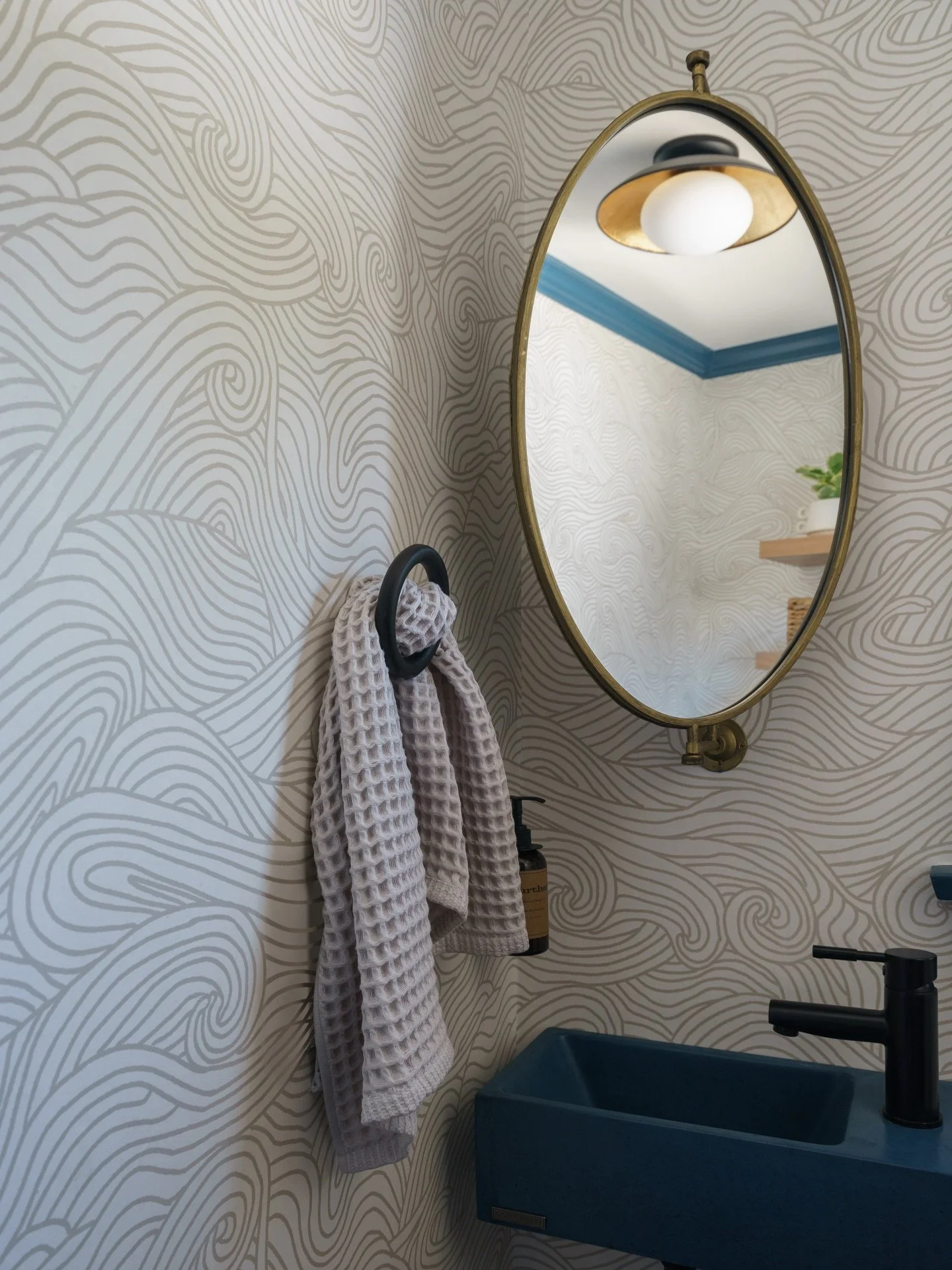 A little drama goes a long way in a small space. 

Deep blue moulding, a hint of movement on the walls, and the tiniest concrete sink moment.

Project #StayInKenwood
Design @stayinteriors_la 
Photos @charlotteleaphotography 
.
.
.
#powderbath #bathro