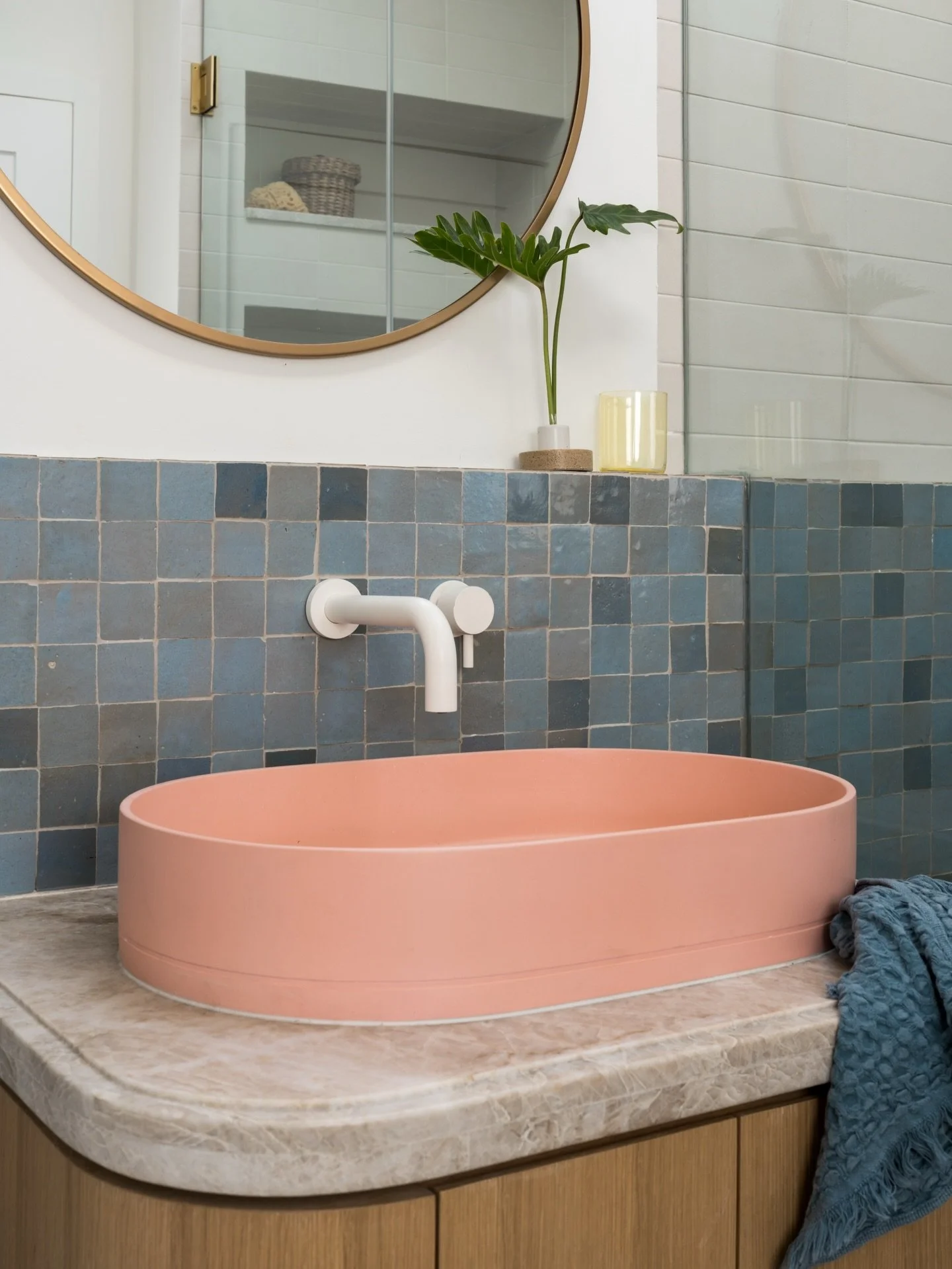 Pretty in pink (and blue)! This bathroom has a skylight over the shower so when the sunlight hits that pale blue zellige it glistens and shows off all the handmade details. 

Project #StayInCasita
Design and styling @stayinteriors_la 
Photos @charlot