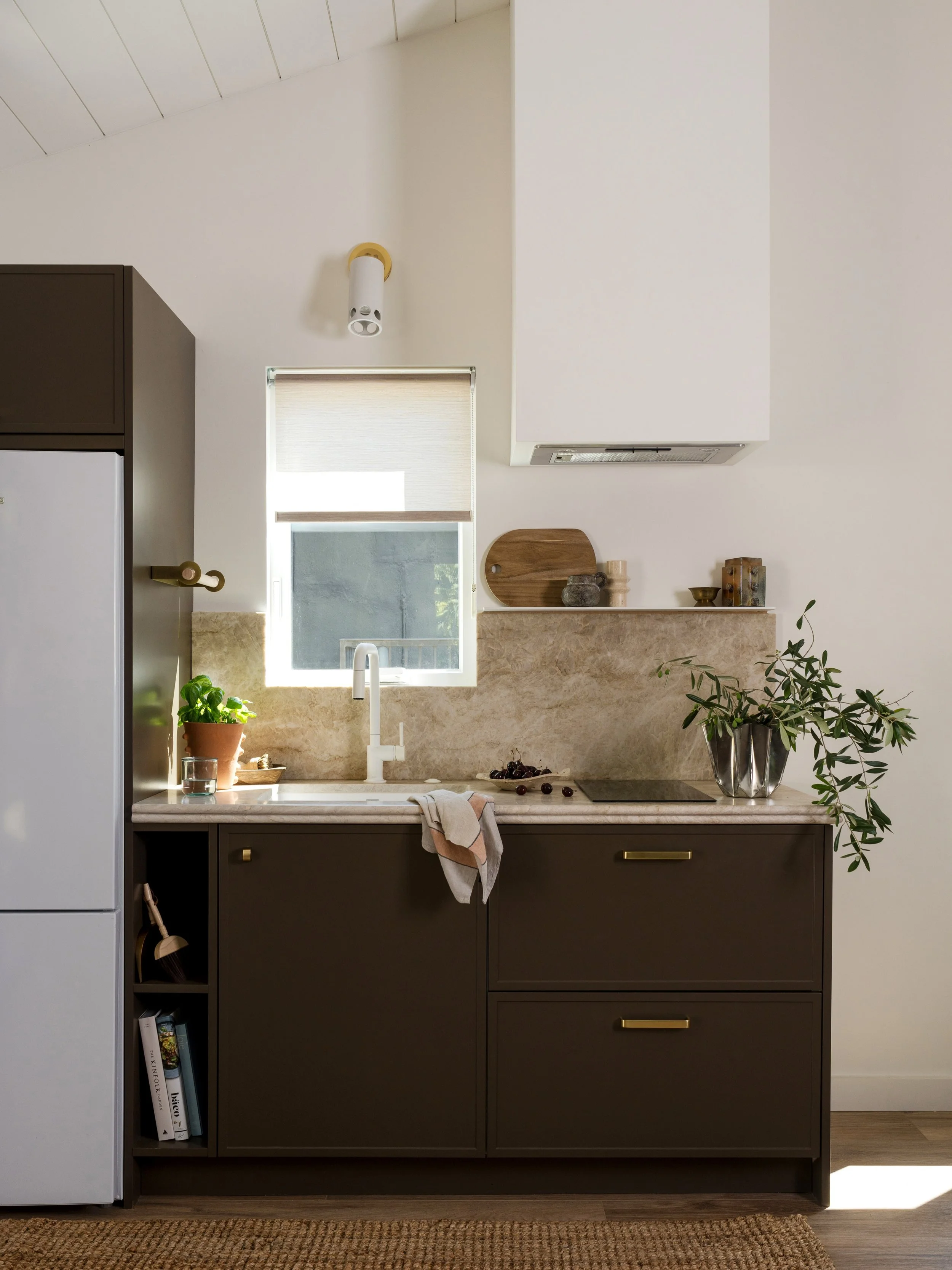This Los Angeles ADU kitchen proves that thoughtful spatial planning can go a long way. We integrated a slim fridge/freezer, sink, induction cooktop, and storage into just 7.5 linear feet! 

Project #StayInCasita 
Design @stayinteriors_la 
Photo @cha