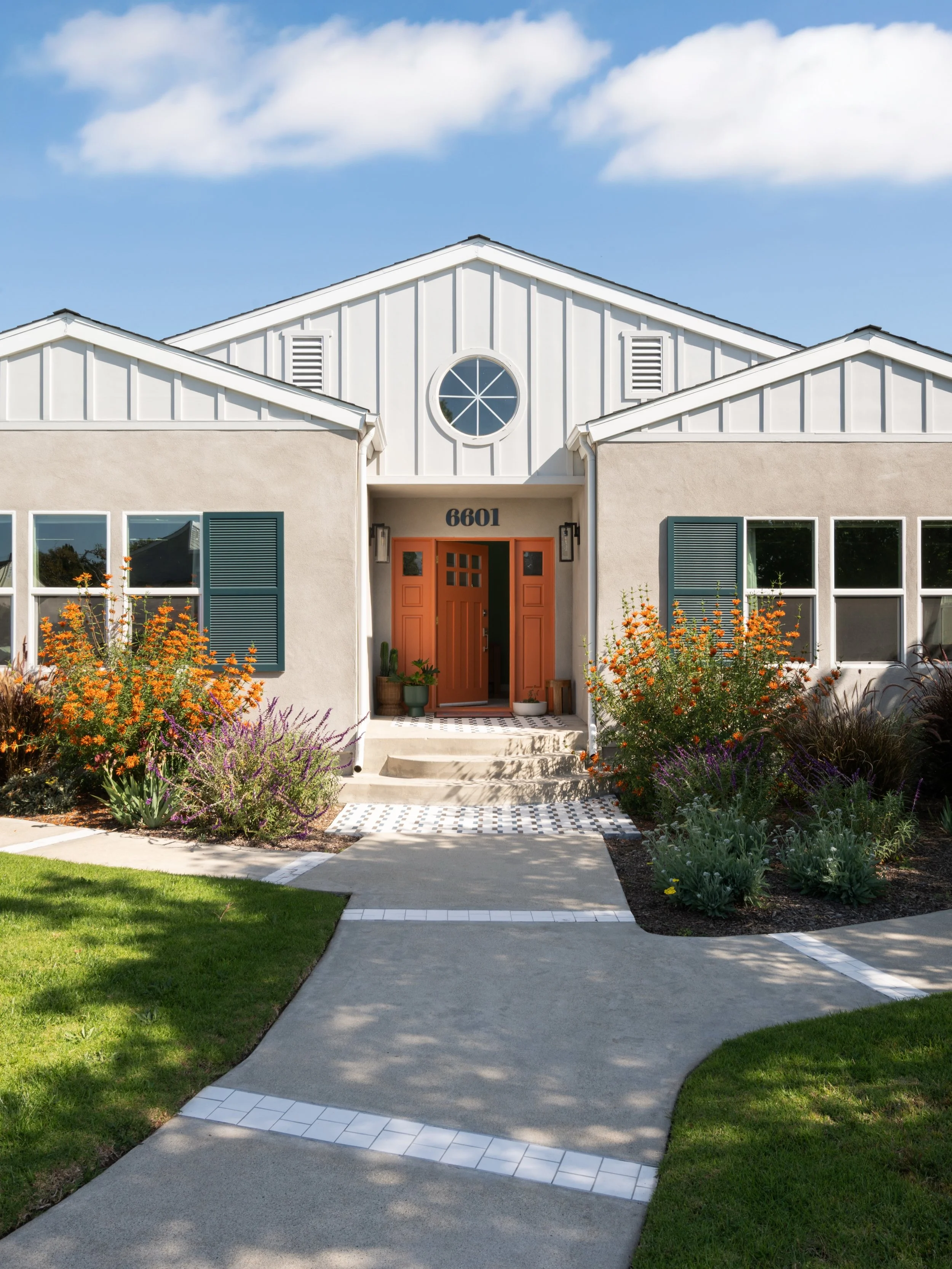 Before &amp; After of this Los Angeles exterior transformation

A once beige facade with heavy detailing is now clean, intentional, and grounded. We simplified the architecture and focused on contrast and material: dark green shutters, a poppy orange