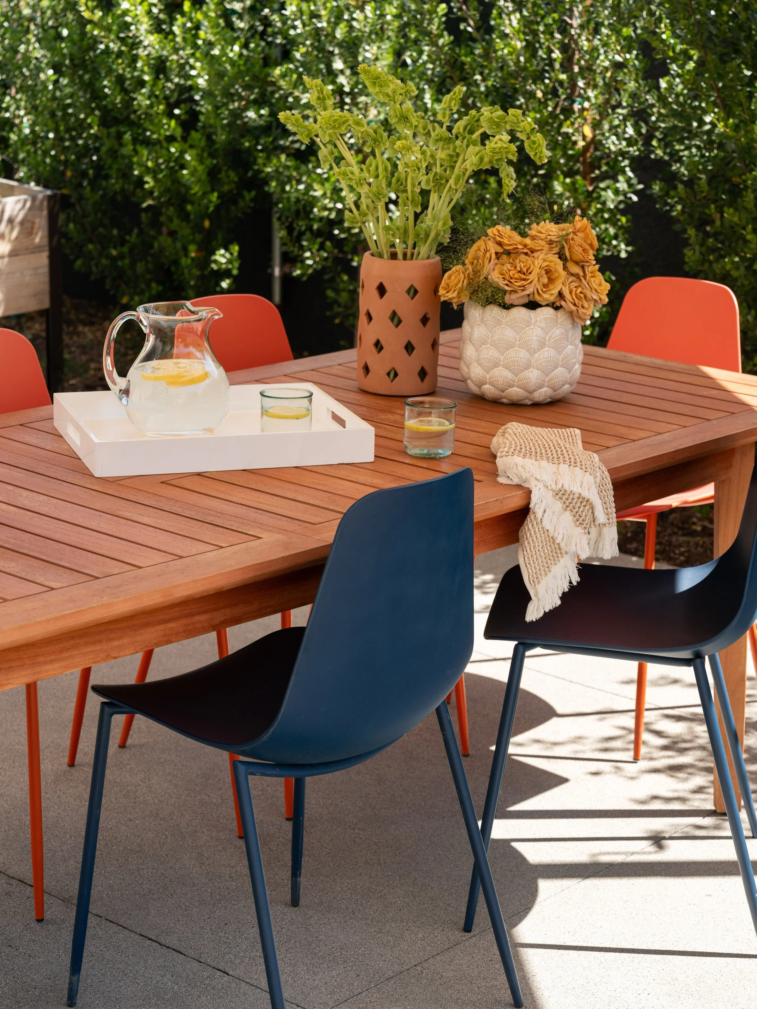 A playful mix of orange and blue chairs to show we&rsquo;re not super serious but we know how to seriously have fun!

In Los Angeles, the outdoors naturally become an extension of the indoors, which made the exterior design the perfect final phase of