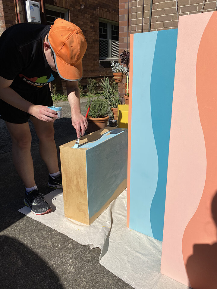 Stephanie painting our stall from items found at Reverse Garbage 2019