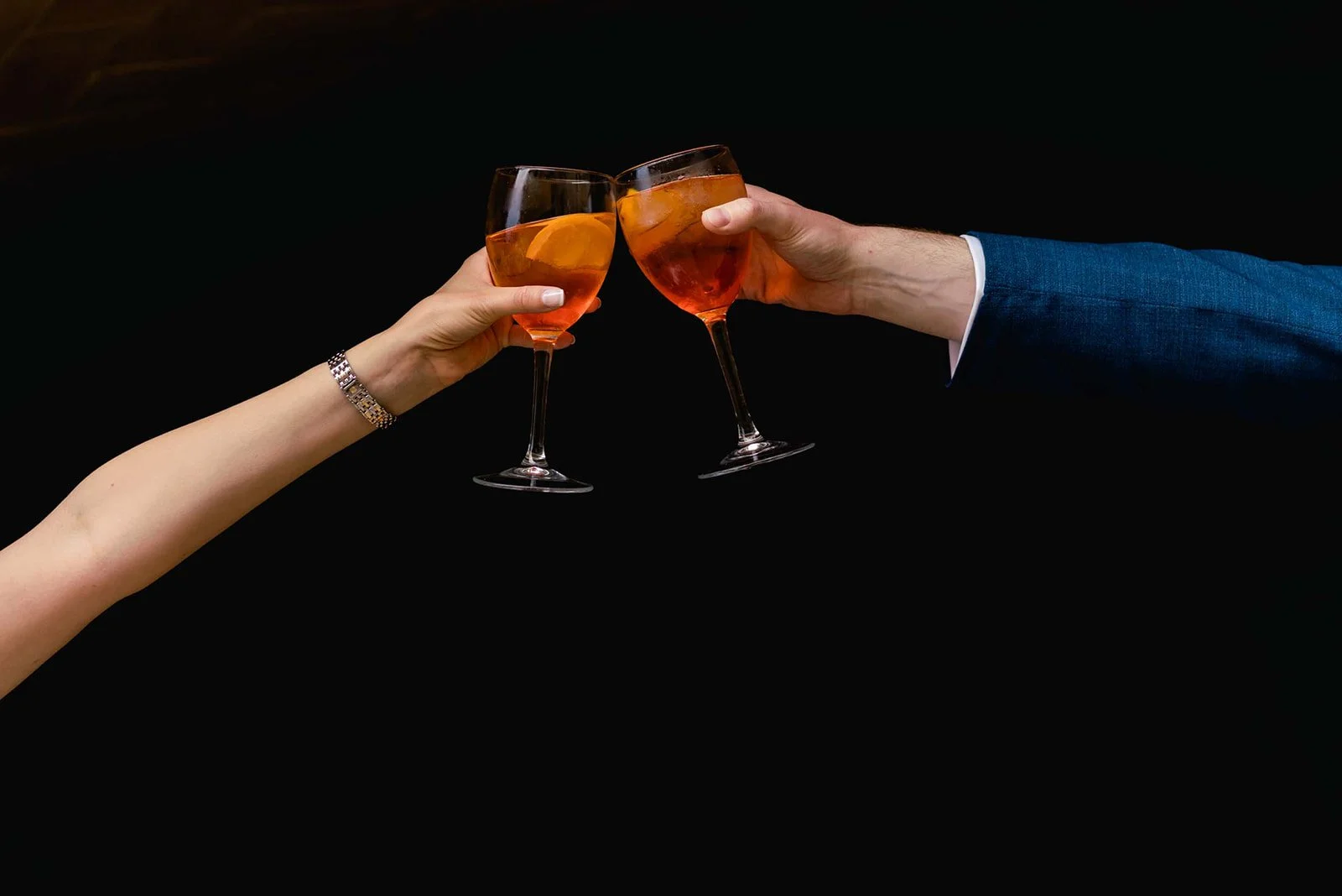 Bride and groom toasting with Aperol Spritz during cocktail hour at La Baronia wedding venue, Barcelona