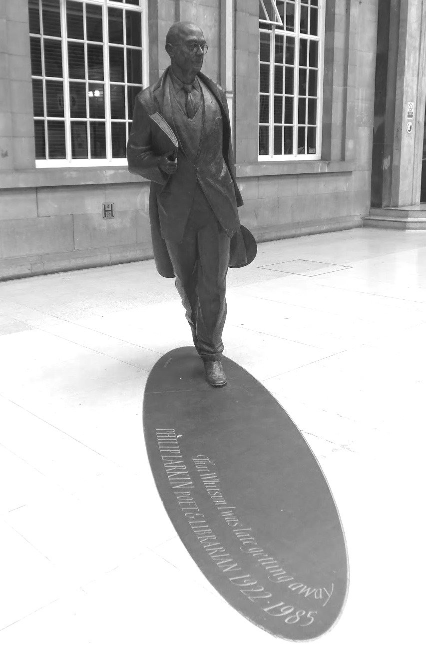 Larkin statue sauntering through the train station of his "other" home, Hull.