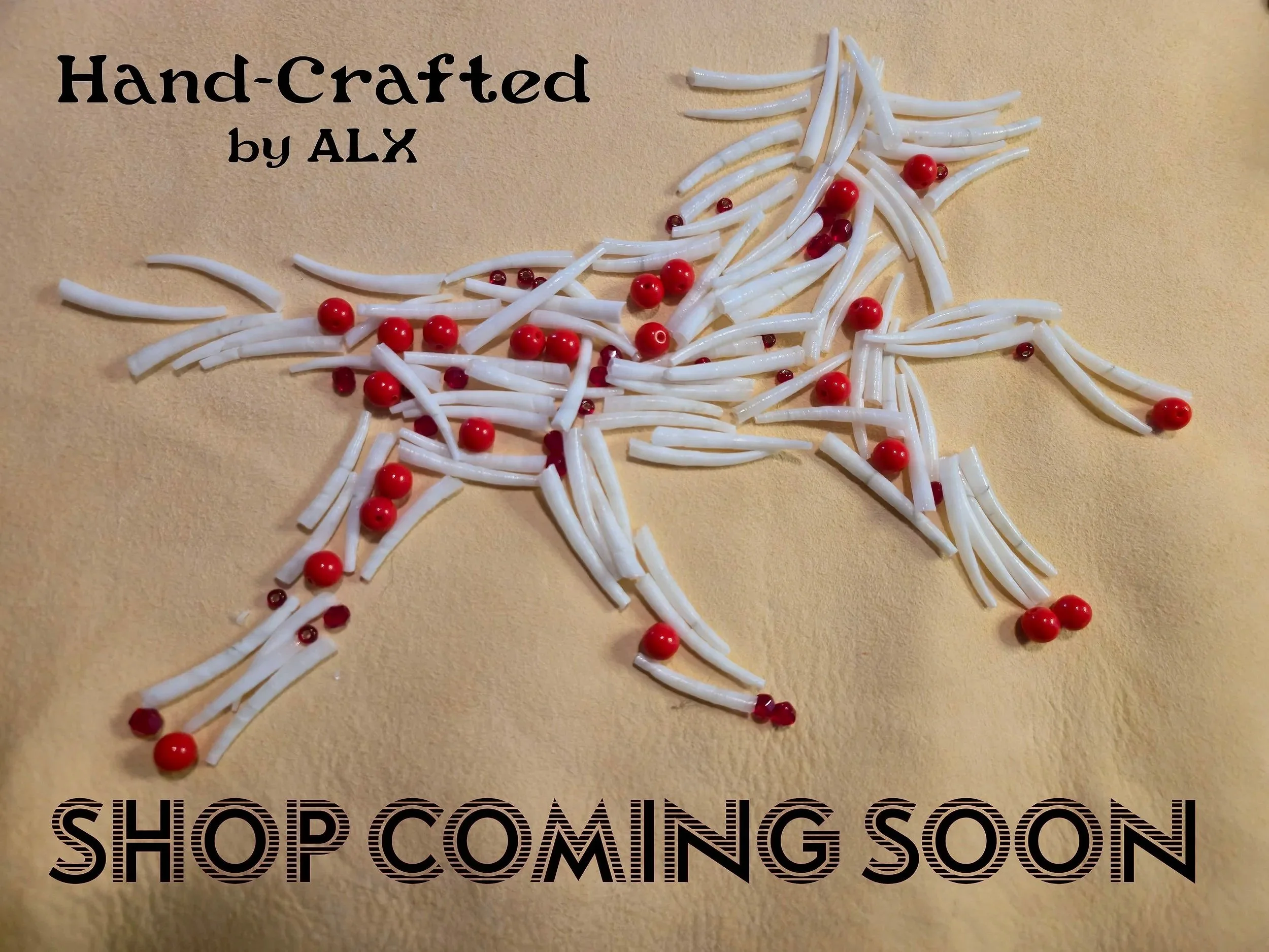 Image showcasing a photograph of dentalium beads and a mix of red beads shaped into a running horse laid on a buckskin surface and text stating "Hand-Crafted by ALX" and "SHOP COMING SOON" on a beige background.