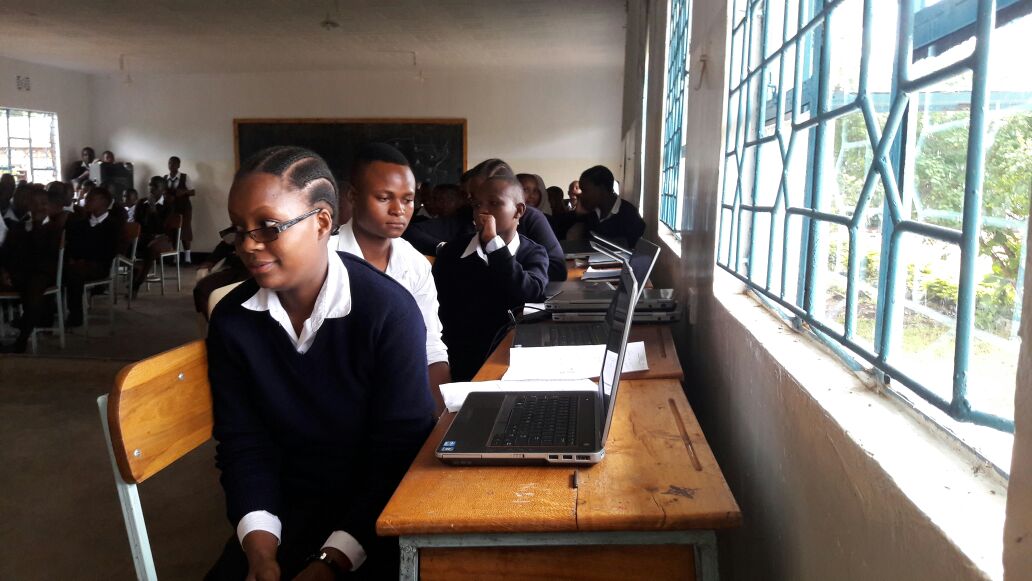 students with the donated laptops