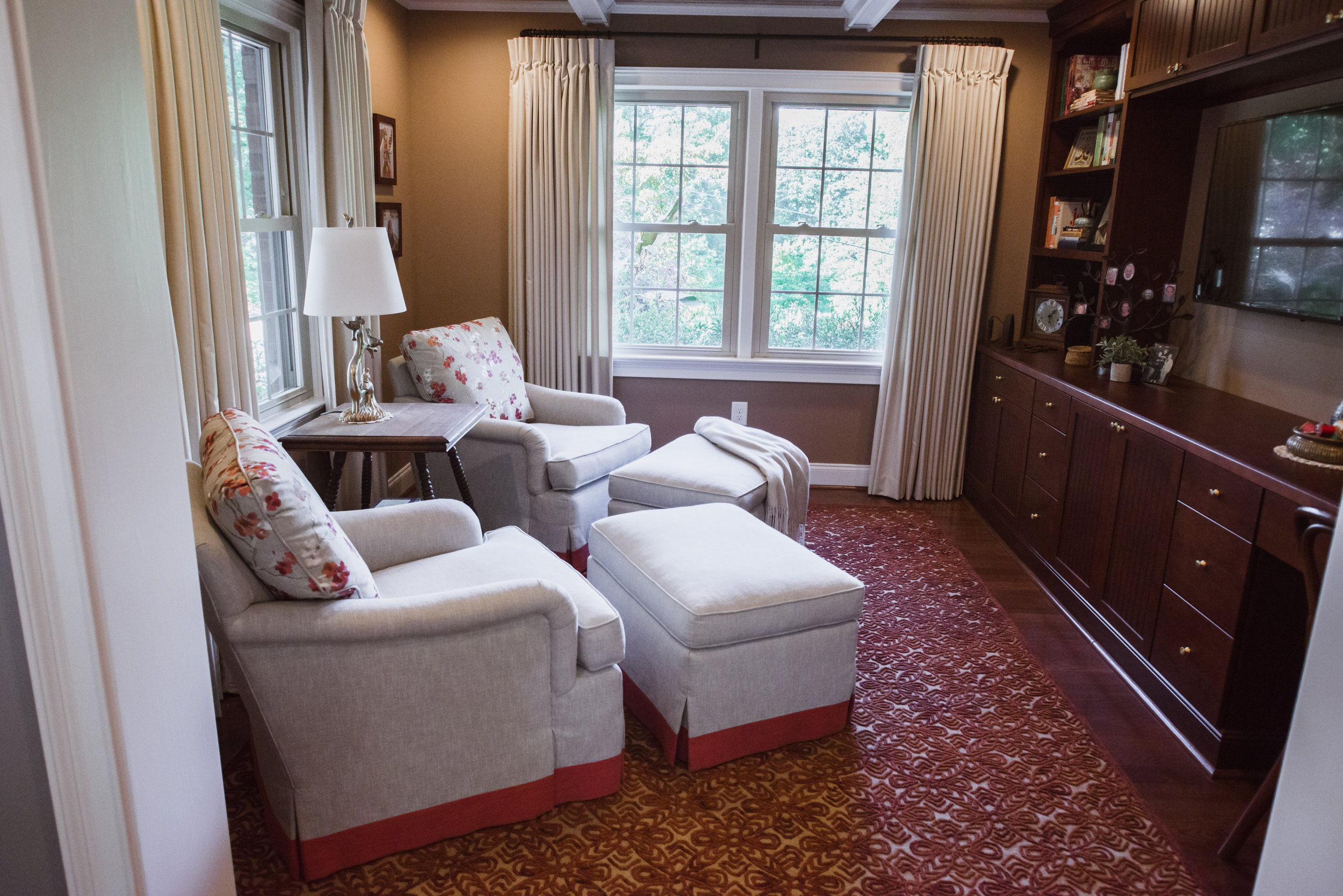 Keeping Room featuring 2 custom club chairs with matching ottoman, custom bookcase and tv center and custom drapery panels. Design by 180 Spaces, NC Lake Norman Interior Designer.