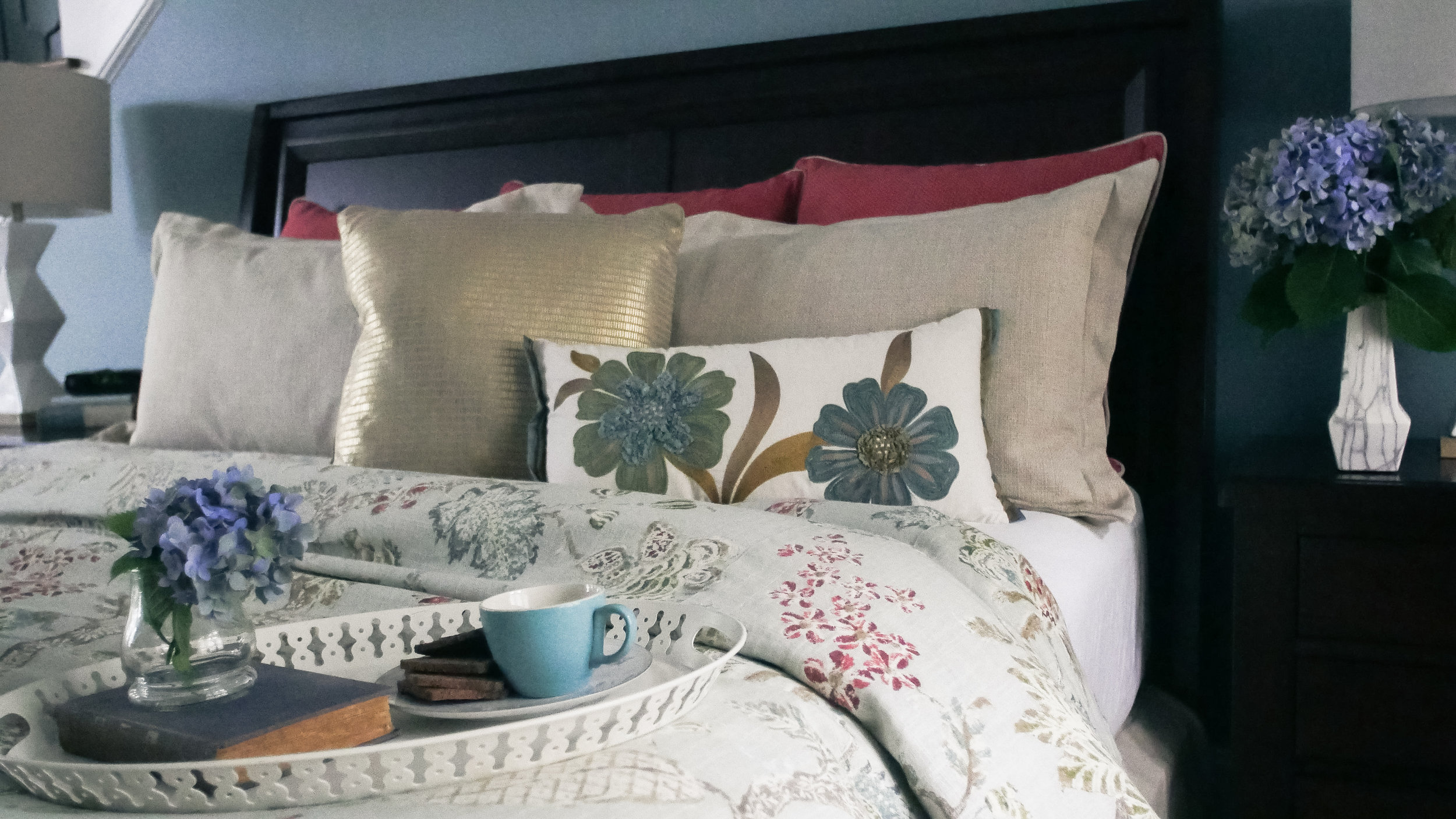 Custom bedding design featuring floral duvet, shams and euro pillows by 180 Spaces | NC Lake Norman Interior Designer 