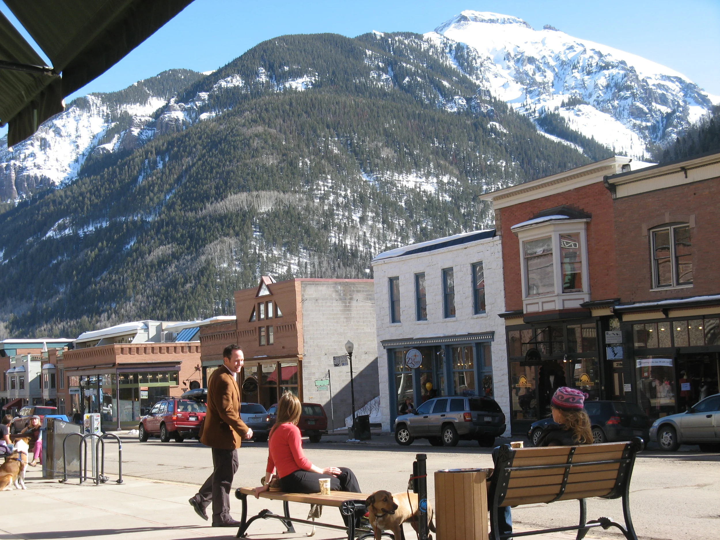 (Houston Chronicle 2009. Photo by Joy Sewing) TELLURIDE, COLO. - It was as if painter Roger Mason knew I was coming. He stood in the middle of the street with his easel, canvas and brush working on a colorful vision of Telluride's dreamy downtown. I dropped my luggage at the door of my hotel to watch him work. Blue clouds settled over the rugged San Juan Mountains in the background. It was early morning, and locals with large, friendly dogs strolled down Colorado Avenue -- Telluride's main street -- heading for their jolt of coffee at one of the many cafes. More