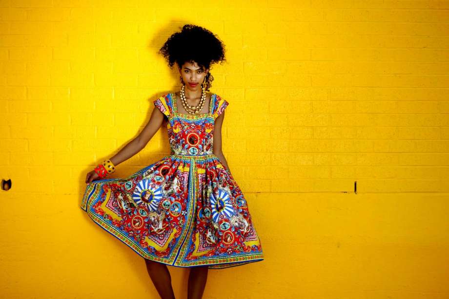 Xochitl Frazier of Page Parkes Models is wearing a Dolce & Gabbana dress, $1,995, from The Webster; and Devon Leigh earrings, $395, and Nest gold necklaces, $295 each, from Neiman Marcus. Her bangles, $125, are available at inspiredluxe.com. Fashion styling by Joy Sewing. Makeup by Tree Vaello. Photo by Gary Coronado. Fashion absorbs culture, and designers take in influences from across the globe and reinterpret them for their collections. So as summer starts, life unwinds and the weather warms, the luxury-fashion scene reveals a mix of cultural accents - Spanish, Asian, African, Indian - all with bohemian appeal. Houston designer Elaine Turner suggests the global trend is part escapism and part fantasy. Shoppers consumed by wanderlust, or even those who have traveled the world, want to look and feel the part of the adventuress. "The cultural influences we see can take you away and carry you to someplace unique, someplace tropical," she says. More