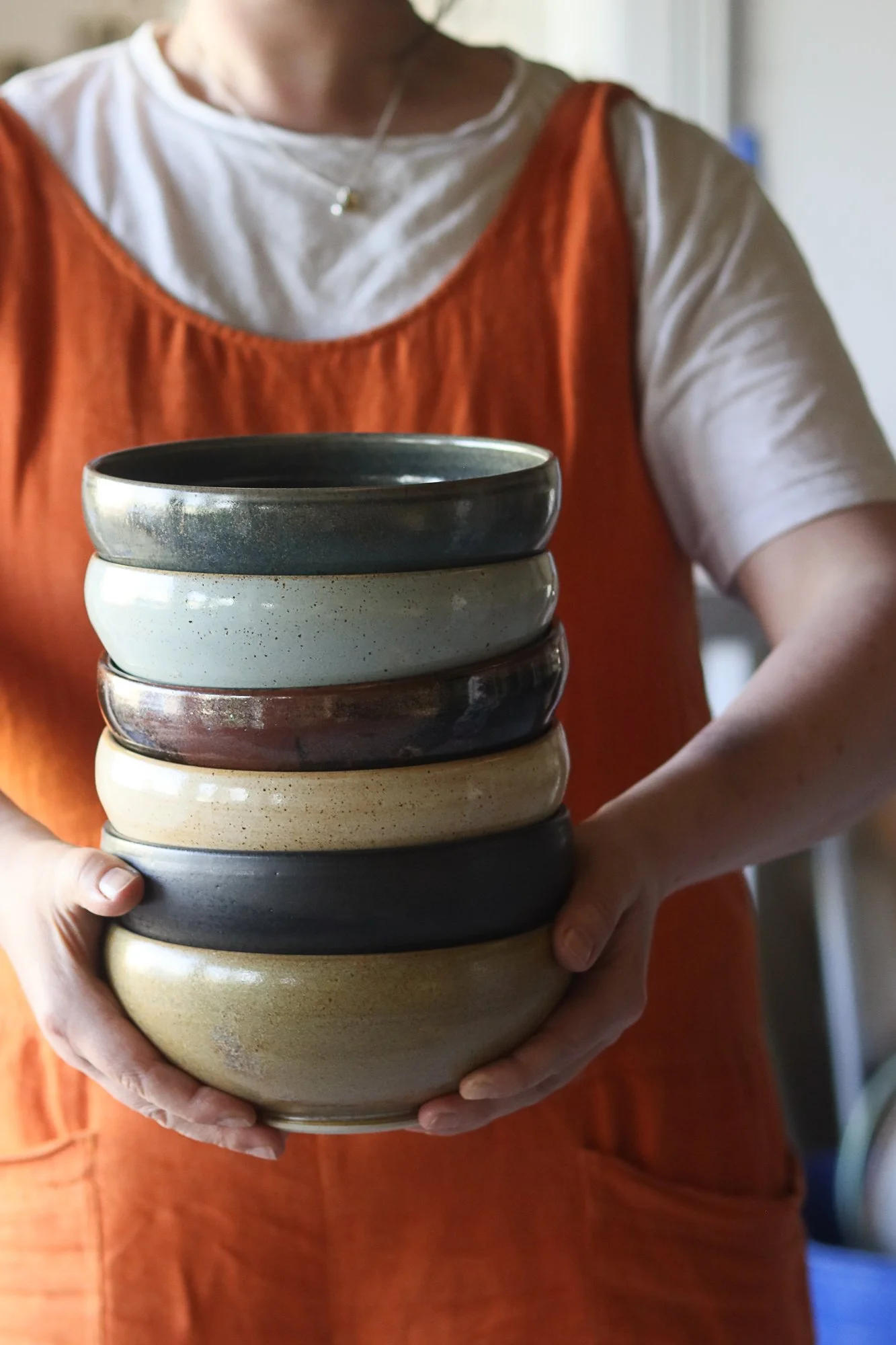 Holding a stack of enclosed bowls