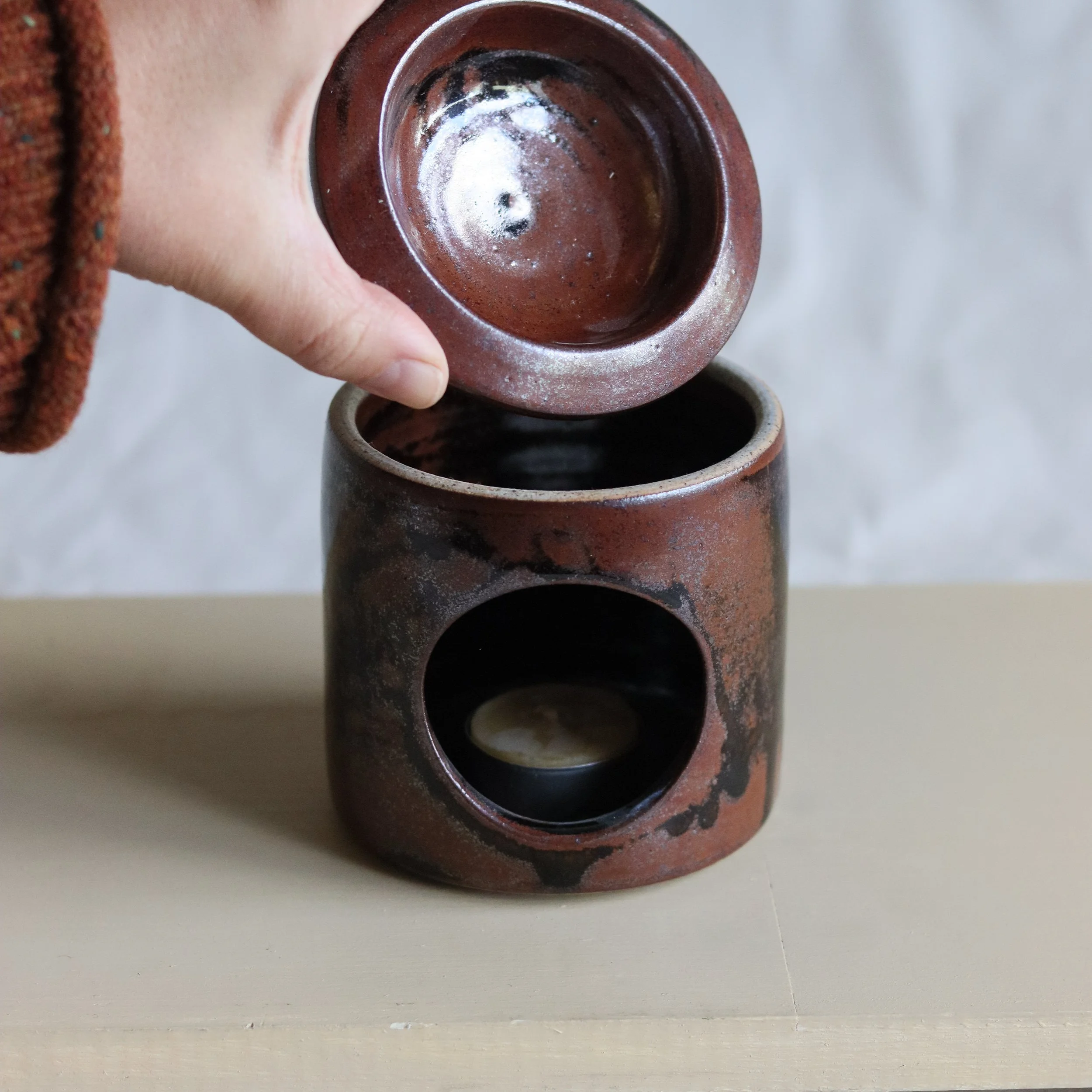 Essential Oil Diffuser made by Pottery West and glazed in a tenmoku type glaze