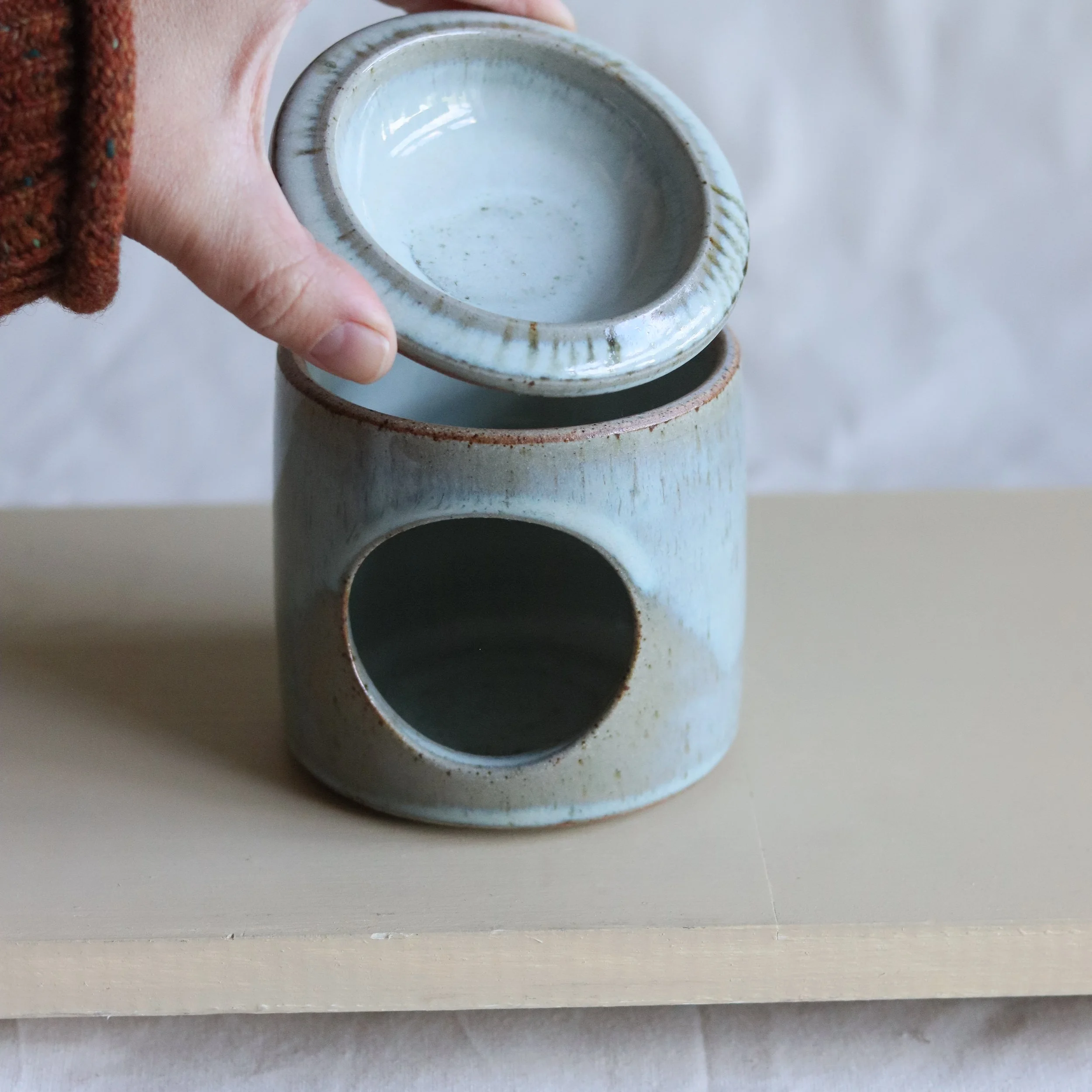 Handmade stoneware essential oil burner by Pottery West in pale blue chun glaze