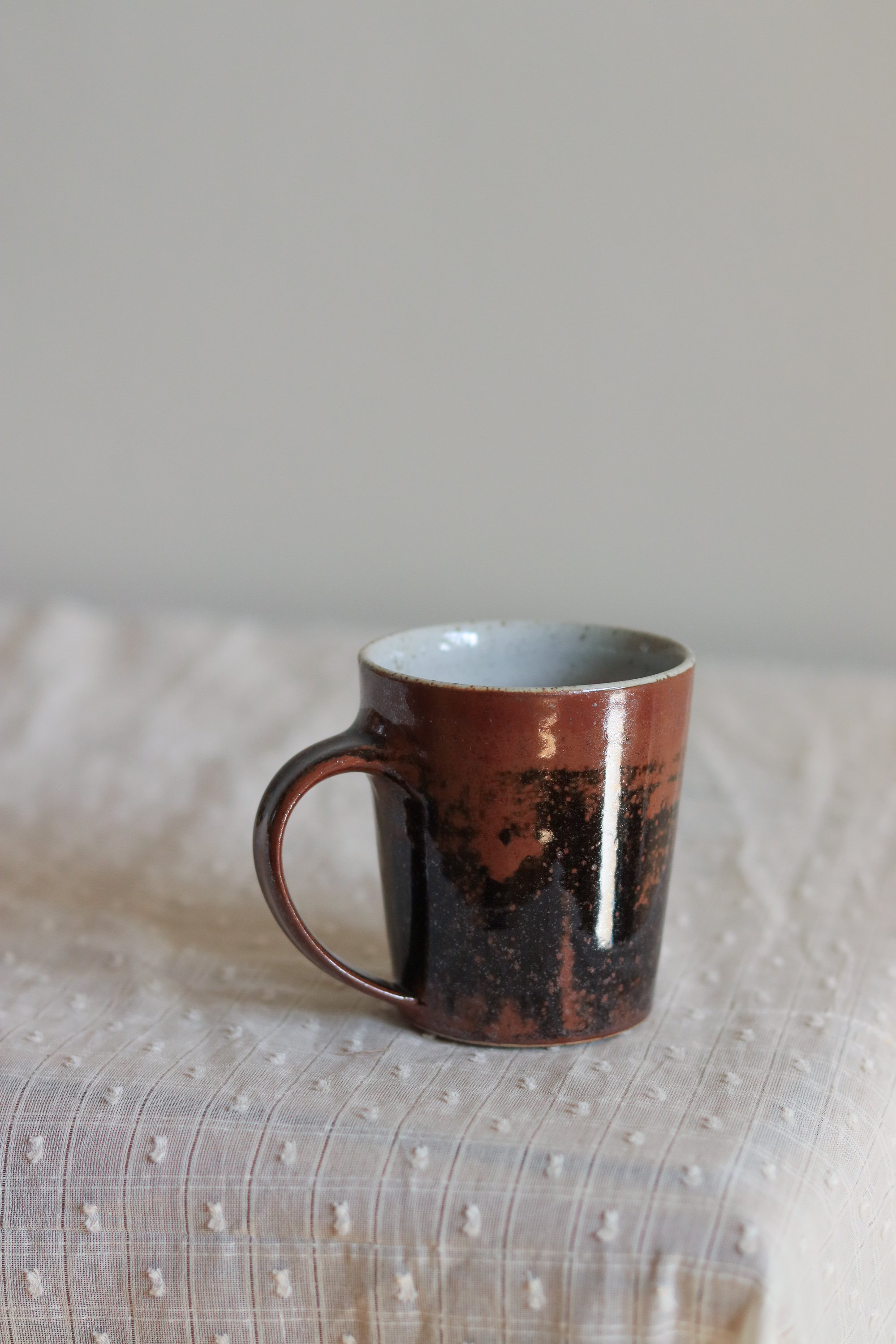 12_Tapered Mug in Tenmoku Chun-1.jpg