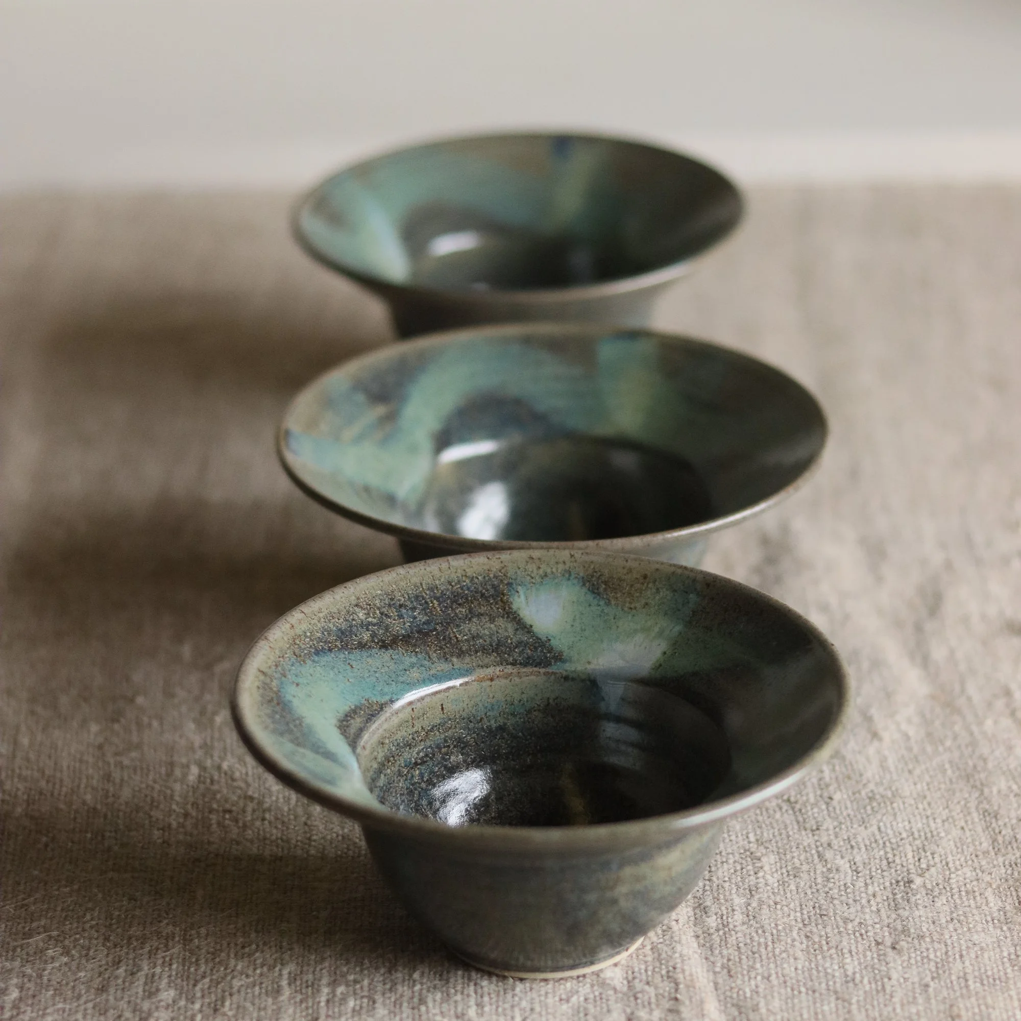 Deep blue nori glaze with brushwork on a flecked stoneware hand thrown bowl, by Pottery West