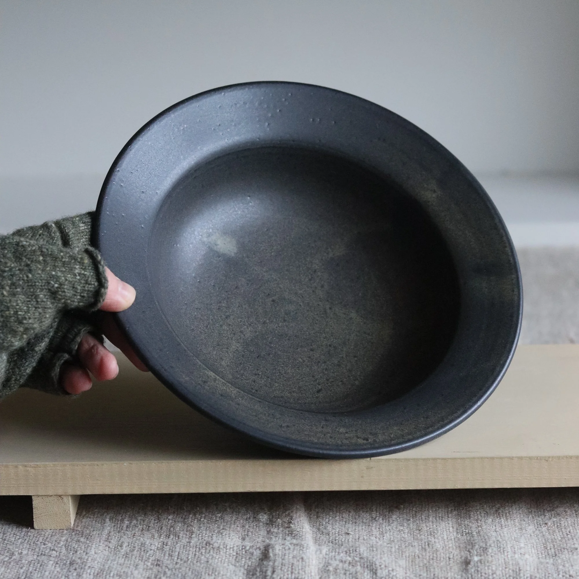 Stoneware lipped dinner bowl in charcoal by Pottery West