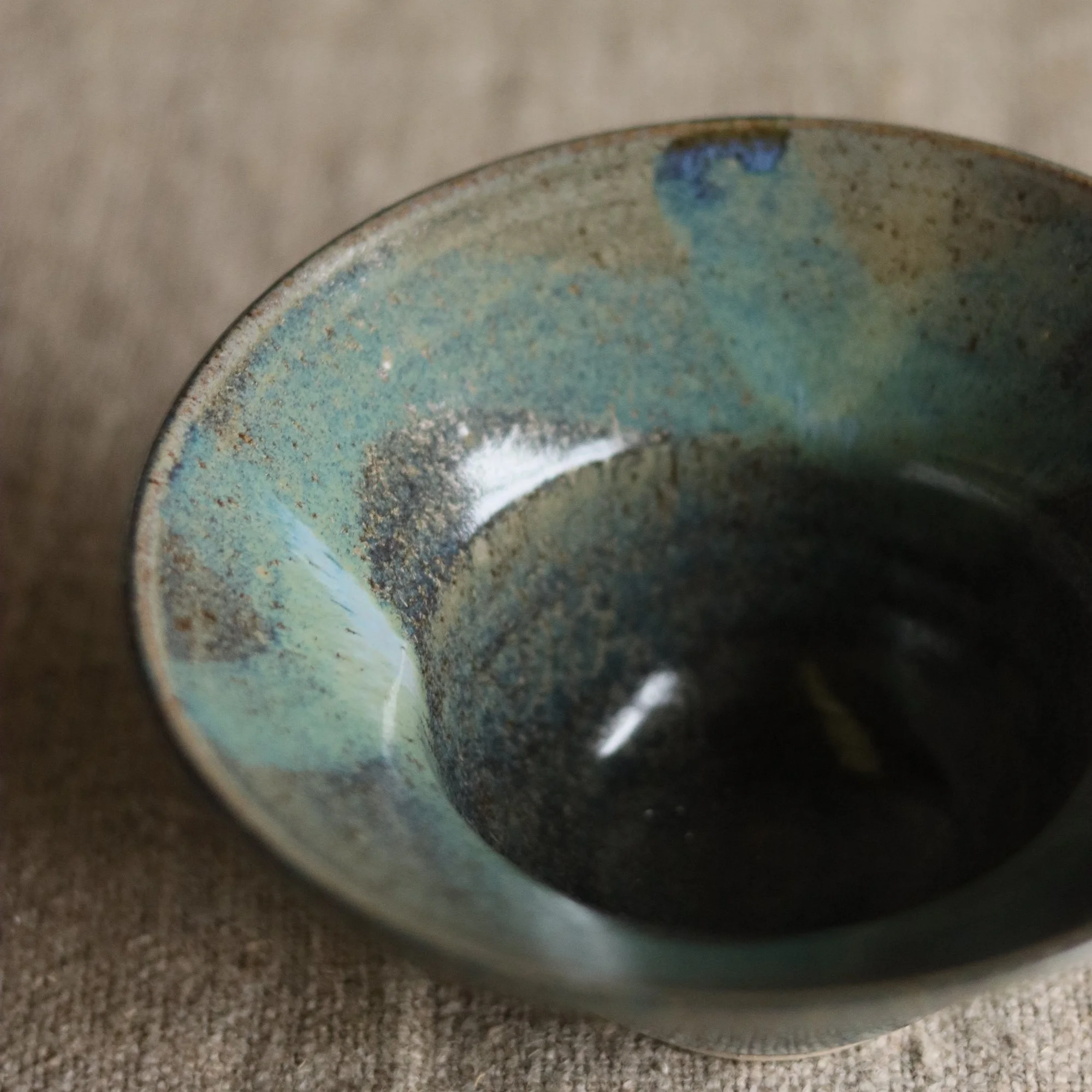 Deep blue nori glaze with brushwork on a flecked stoneware hand thrown bowl, by Pottery West