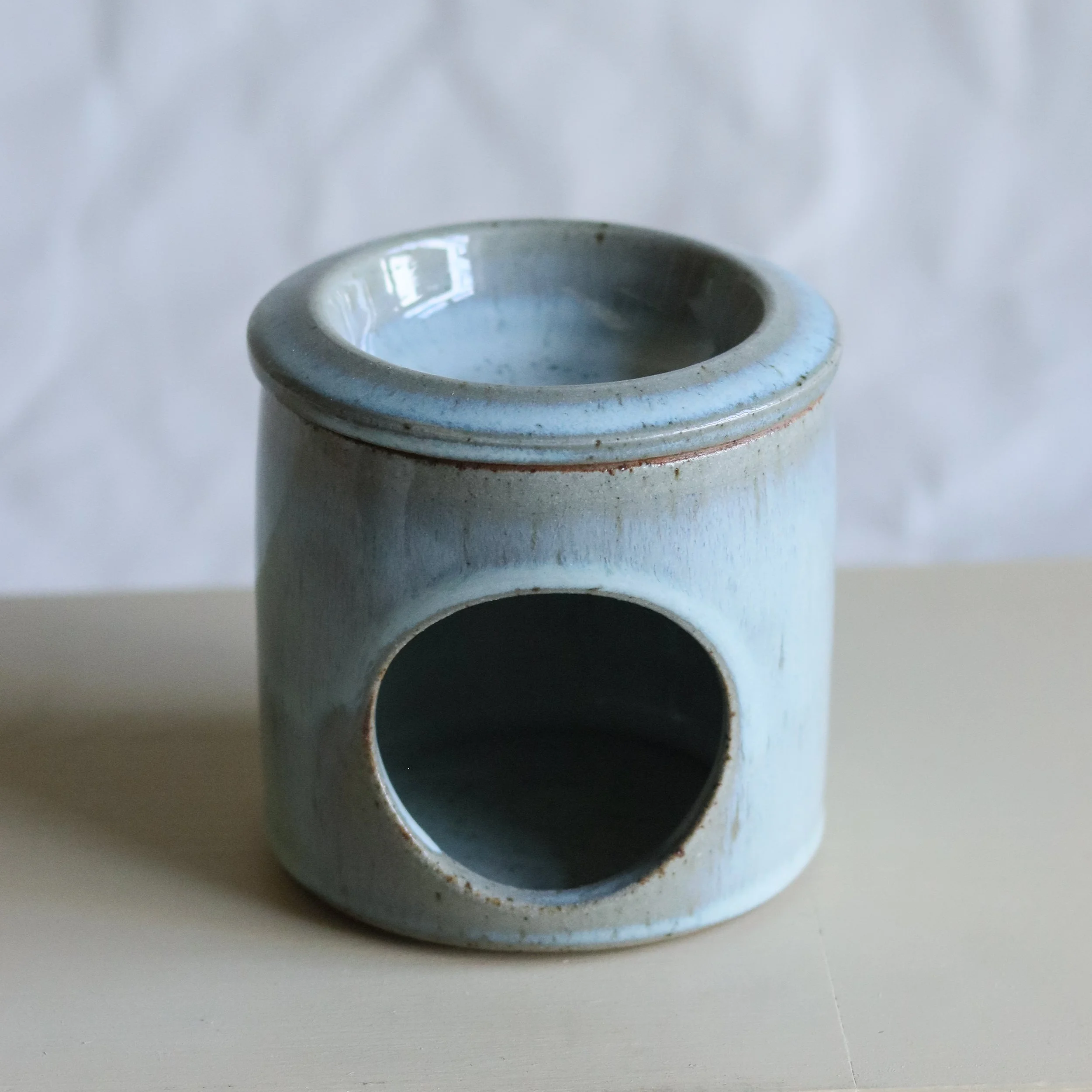 Essential Oil Burner / Diffuser hand-thrown in our flecked stoneware and glazed in our pale blue chun glaze.  This pot has been reduction fired in a gas kiln.