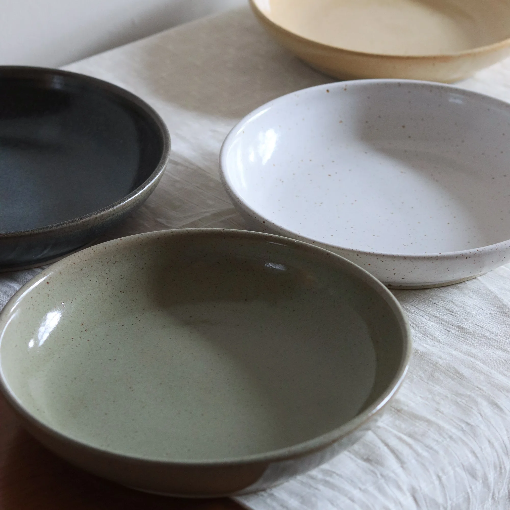Stoneware dinner bowls, hand made in small batches in Yorkshire by Catherine and Matt West