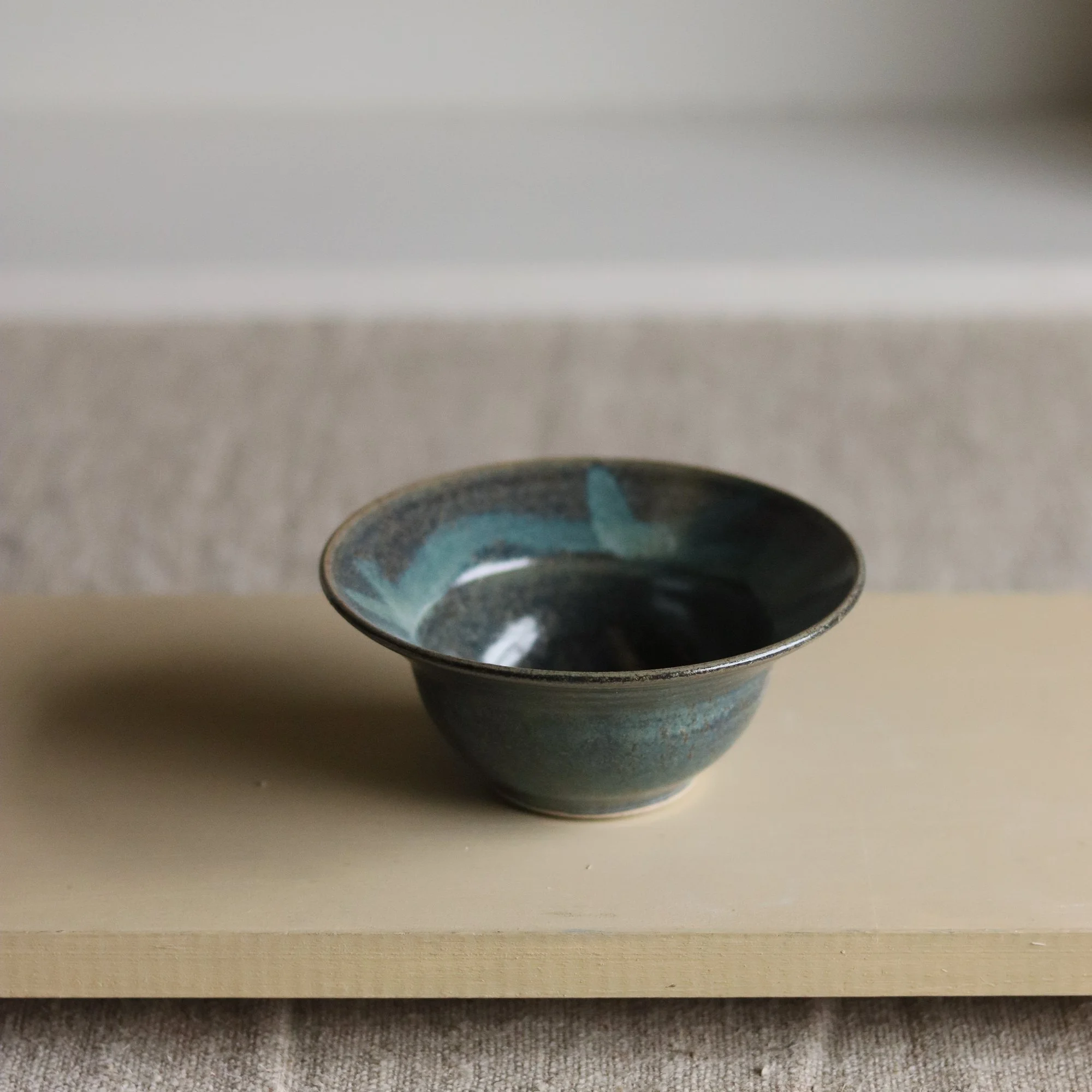 Stoneware hand thrown dark blue green bowl by Pottery West