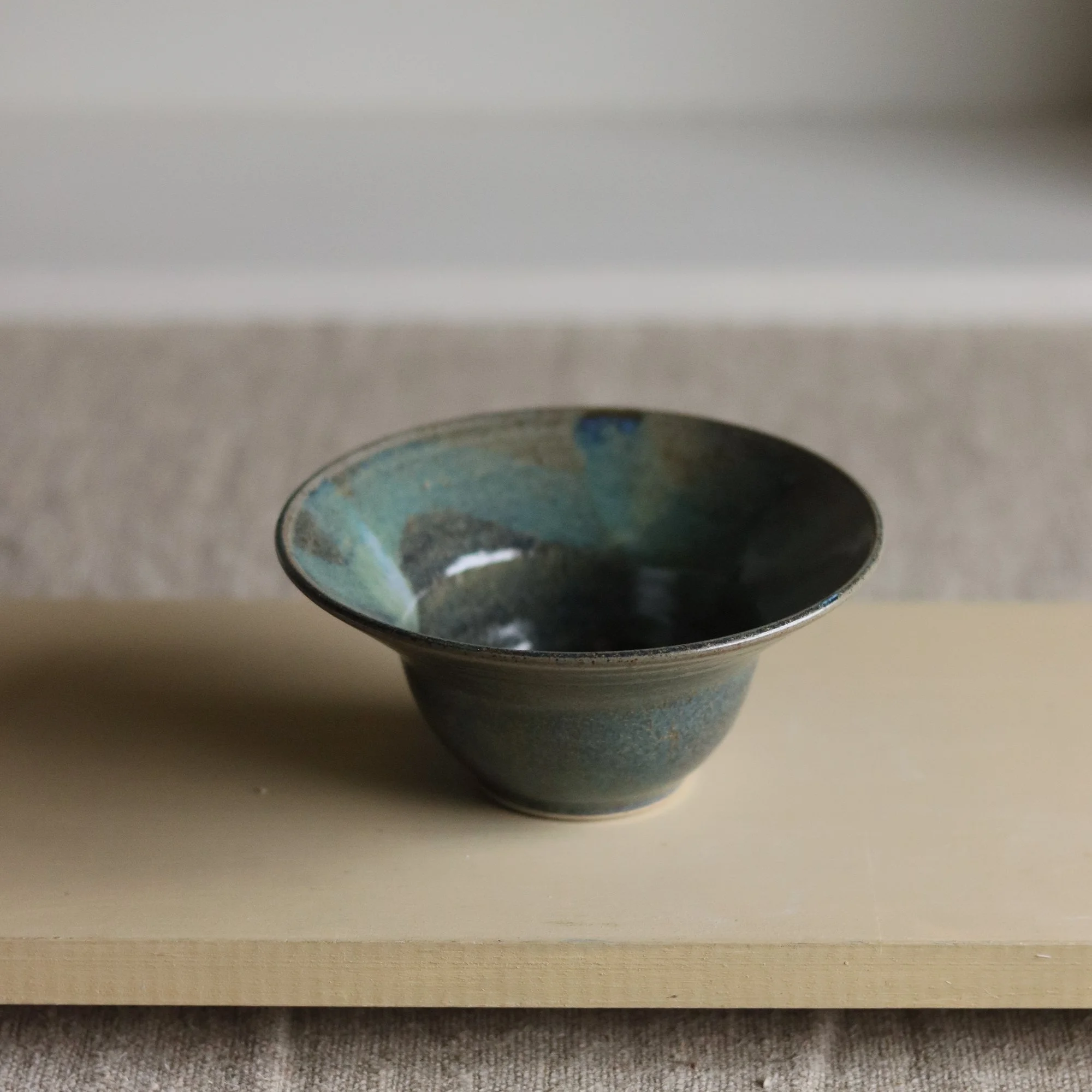 Deep blue nori glaze with brushwork on a flecked stoneware hand thrown bowl, by Pottery West