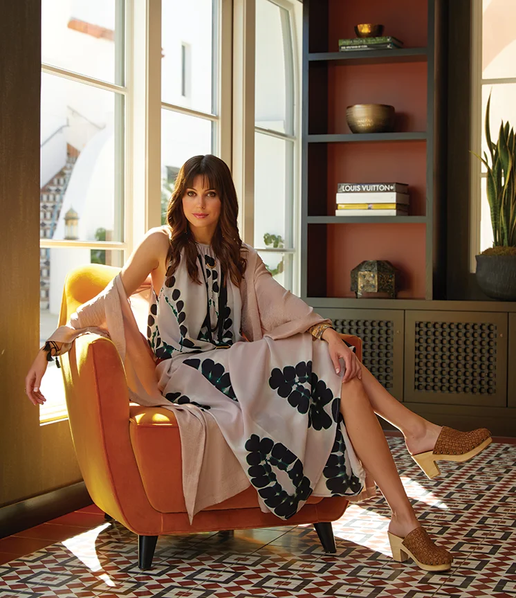 Lounging in the hotel lobby: Dress and beaded bracelets, PLUM GOODS. Kimono robe, ROWAN. Shoes, AMBIANCE. Tassel bracelets and belt, THE SHOPKEEPERS. Necklace, JAKE & JONES.