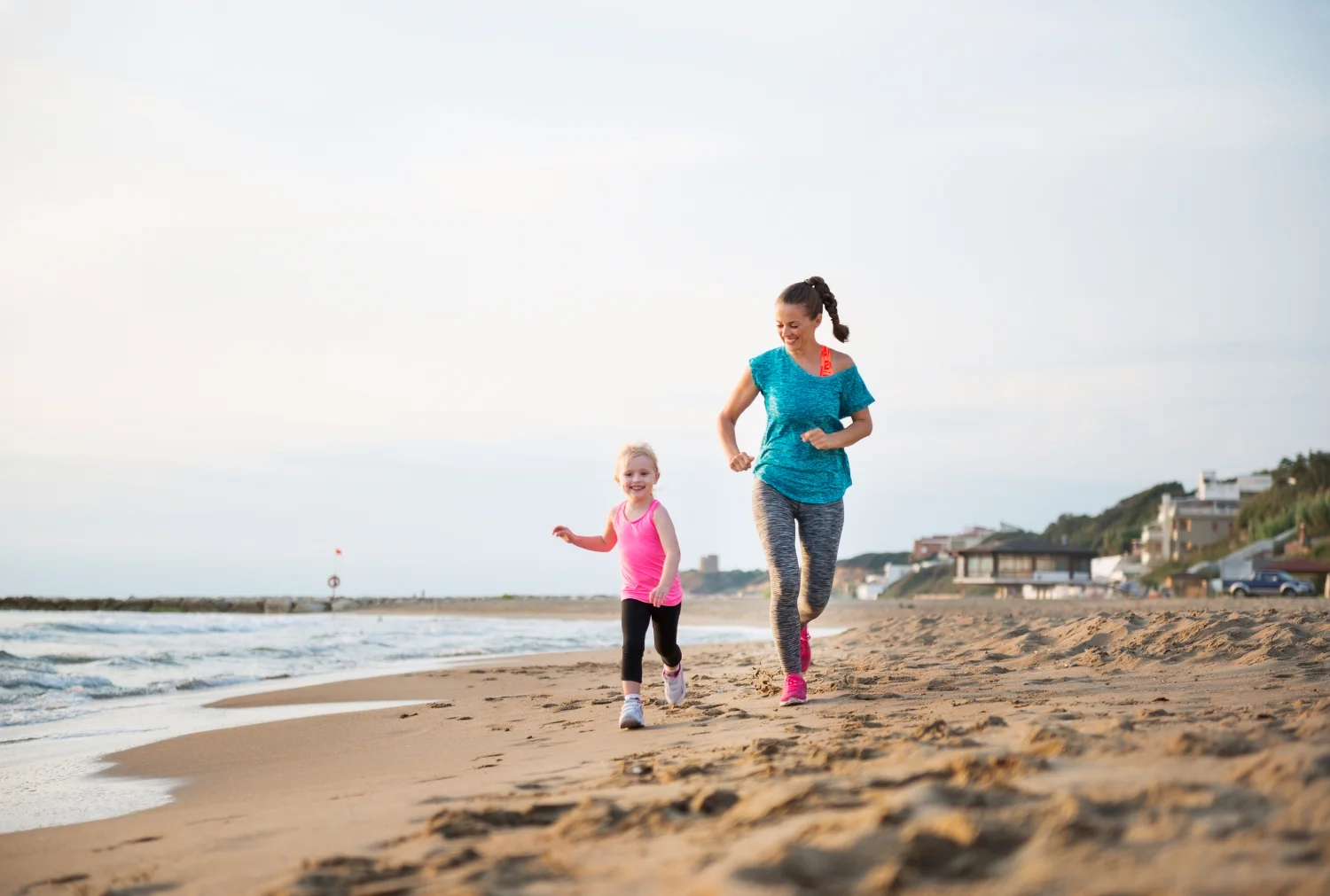 BABY - Mother running on beach.jpg
