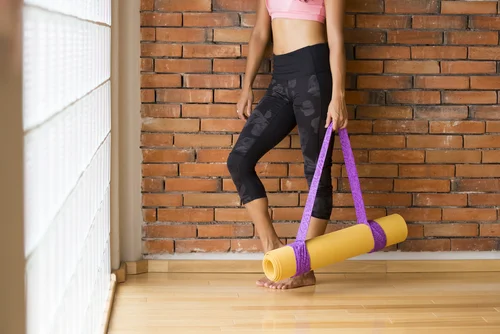 Chick with yoga mat for consultation.jpg