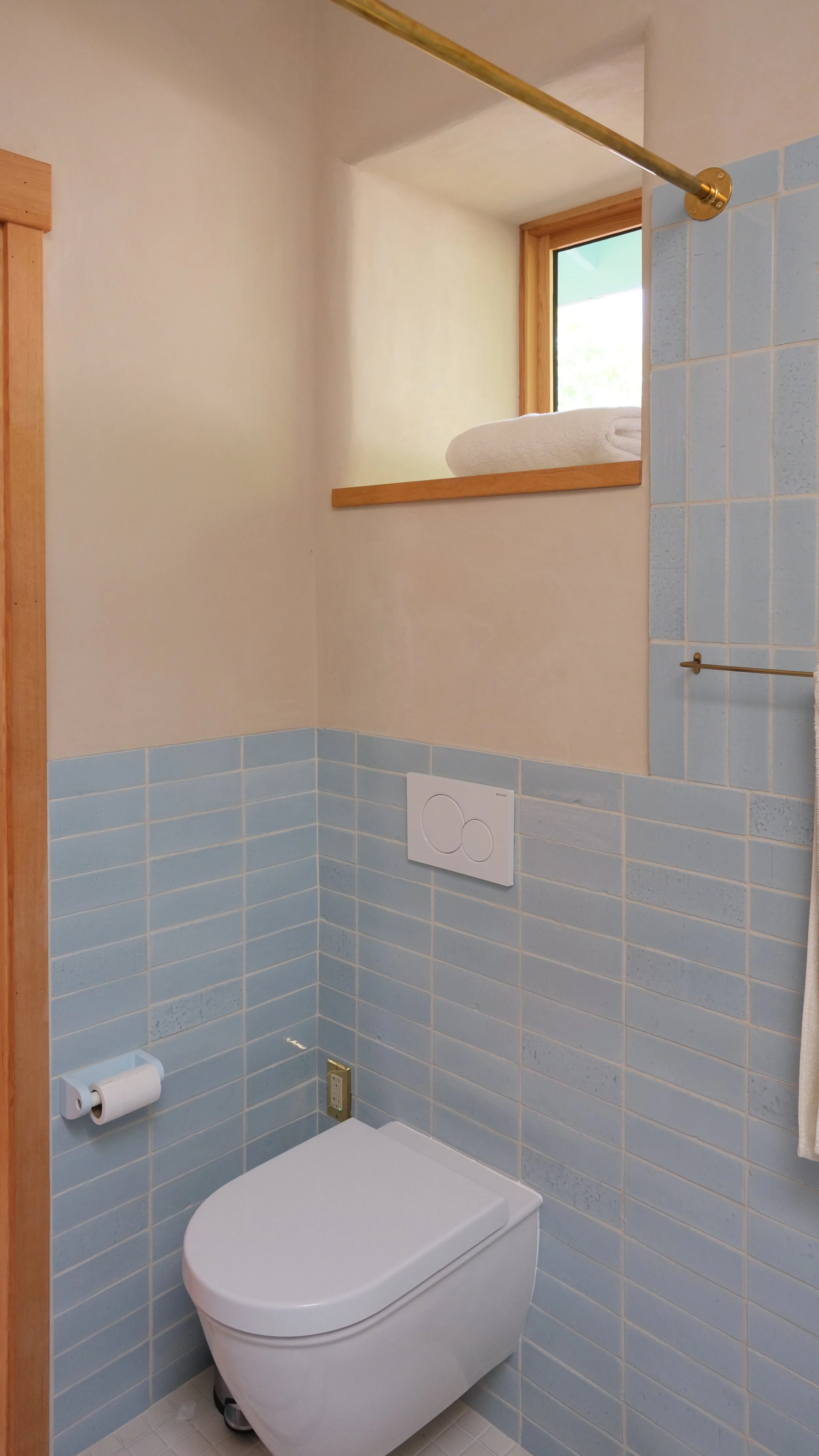 Wall hung WC with deep window above