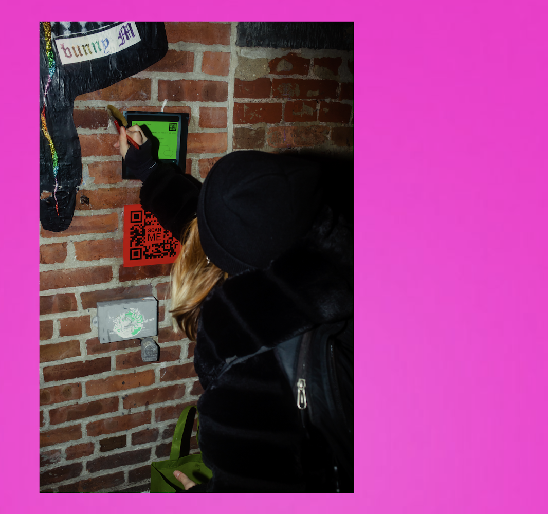 Von wheat pasting her vonxday campaign in NYC, provided by Von