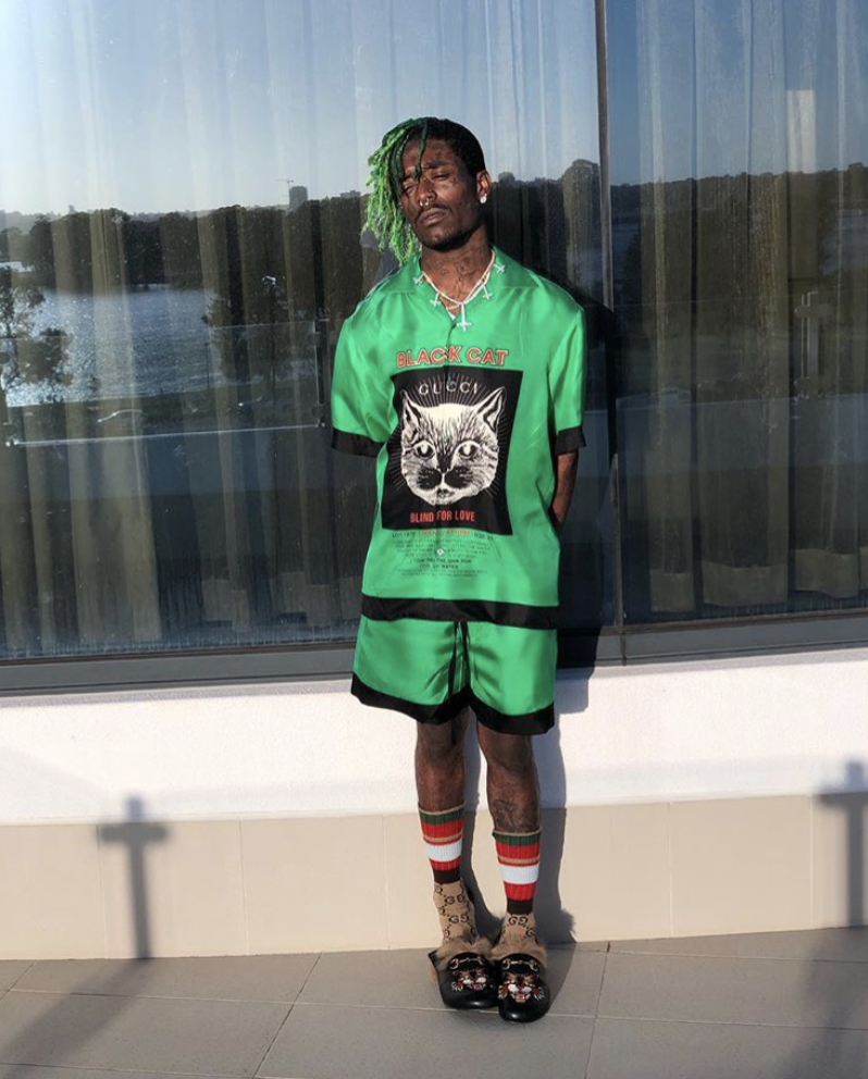 An outfit posted to Lil Uzi Vert's Instagram, under which someone commented "Stand like a man you lil bitch".