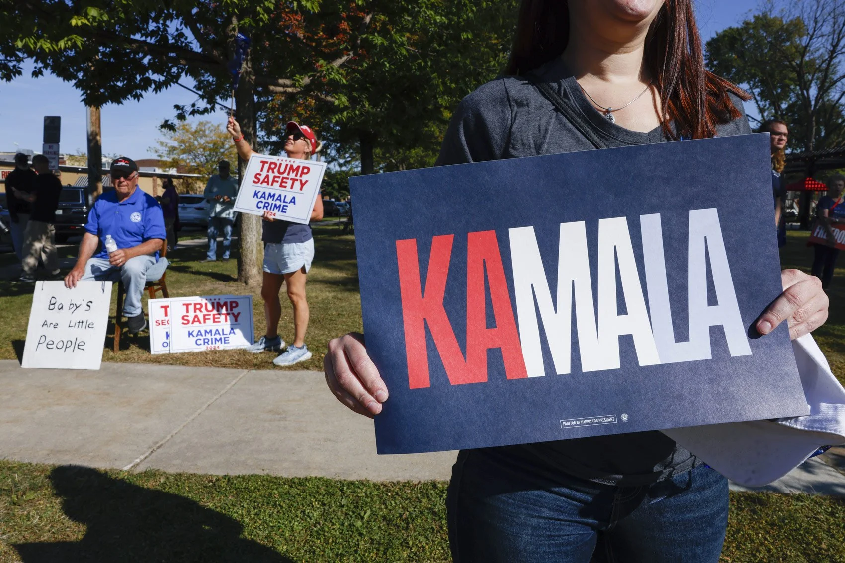 kamala-trump-signs-election-2024-cap-times-ruthie-hauge-battleground-wisconsin.jpg