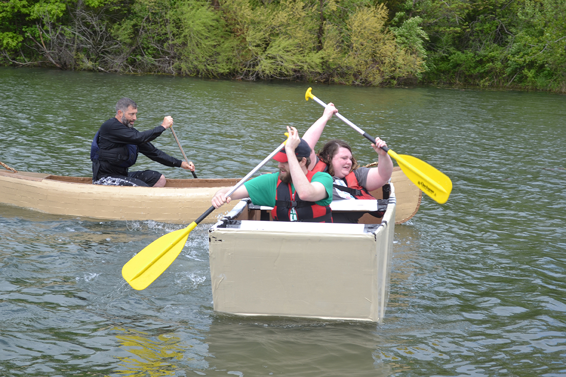 CAFNR's Core of Discovery canoe catches up to competitor Socket at Saturday's Float Your Boat for The Food Bank.