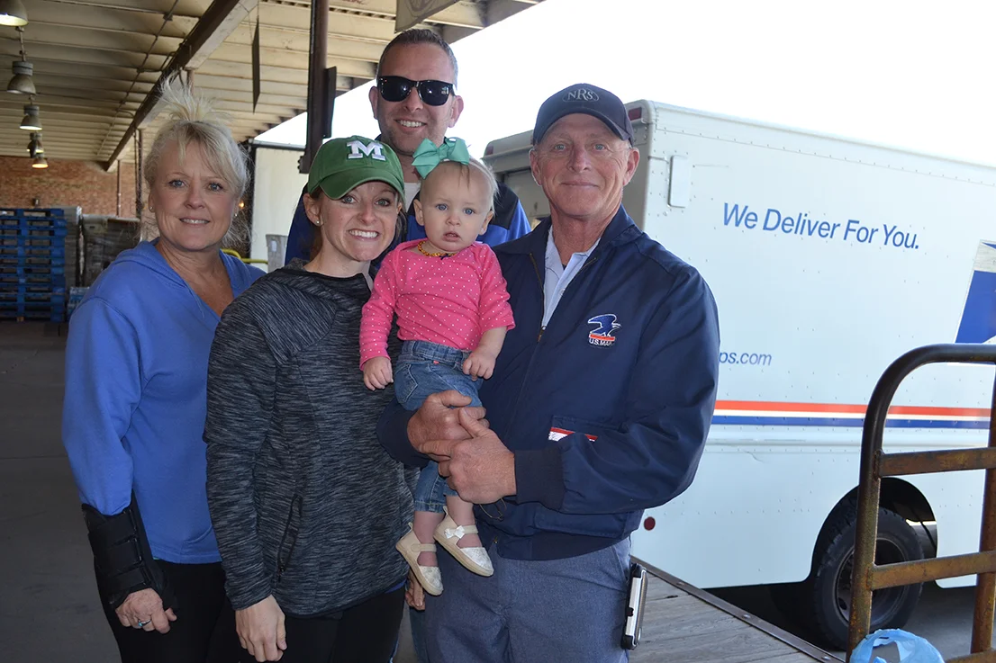 Lindell Lee, right, with daughter, Amanda Quick and granddaughter, Ellie, son-in-law, Sean, and sister Debbie Lee at Stamp Out Hunger in Columbia.
