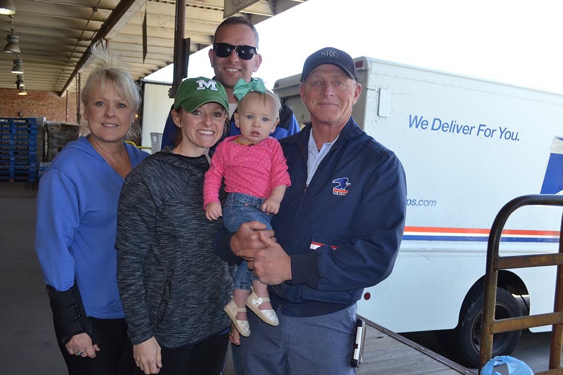 Lindell Lee, right, with daughter, Amanda Quick and granddaughter, Ellie, son-in-law, Sean, and sister Debbie Lee at Stamp Out Hunger in Columbia.