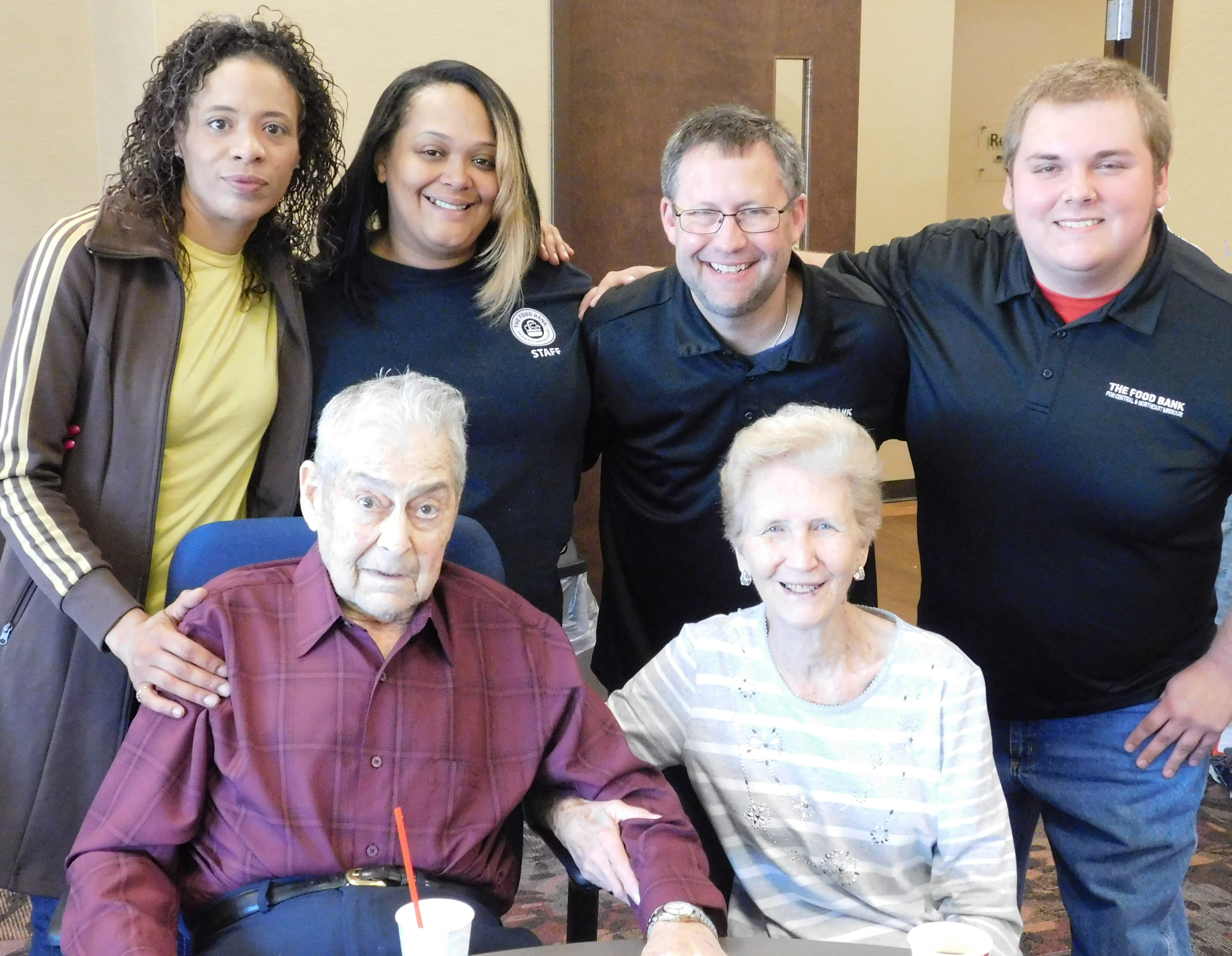 Marion and Shirley Ballard with Volunteer Room staff, from left, Teresa Coleman, Emily Herrell, John Itschner and Taylor Perry.