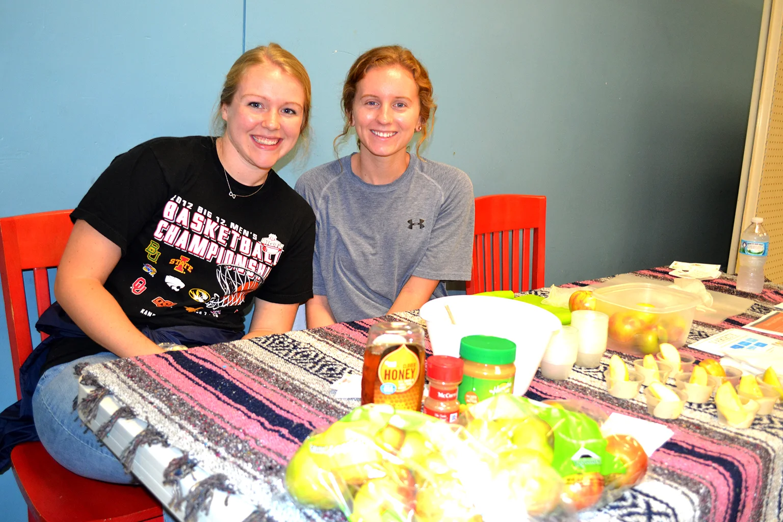 Danielle Carrillo and Kate Casey distribute samples of a healthy snack at Central Pantry.