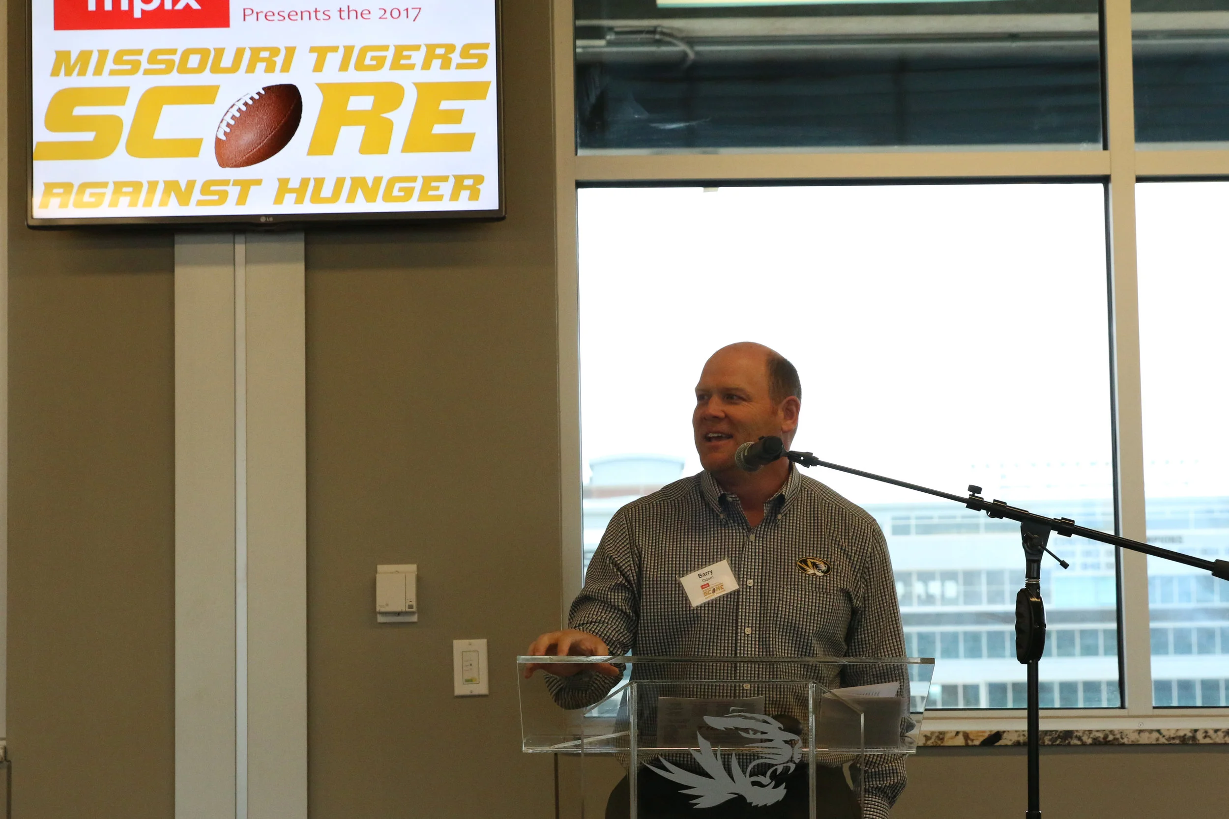 Missouri Tigers Head Football Coach Barry Odom address supporters at the Score Against Hunger Victory Luncheon at Memorial Stadium.