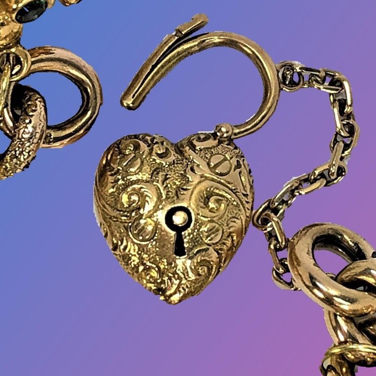 18 kt yellow gold charm bracelet with heart lock key