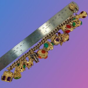 Midcentury Italian Gold Etruscan Revival Charm Bracelet-11 Assorted Color  Charms — Benchmark of Palm Beach