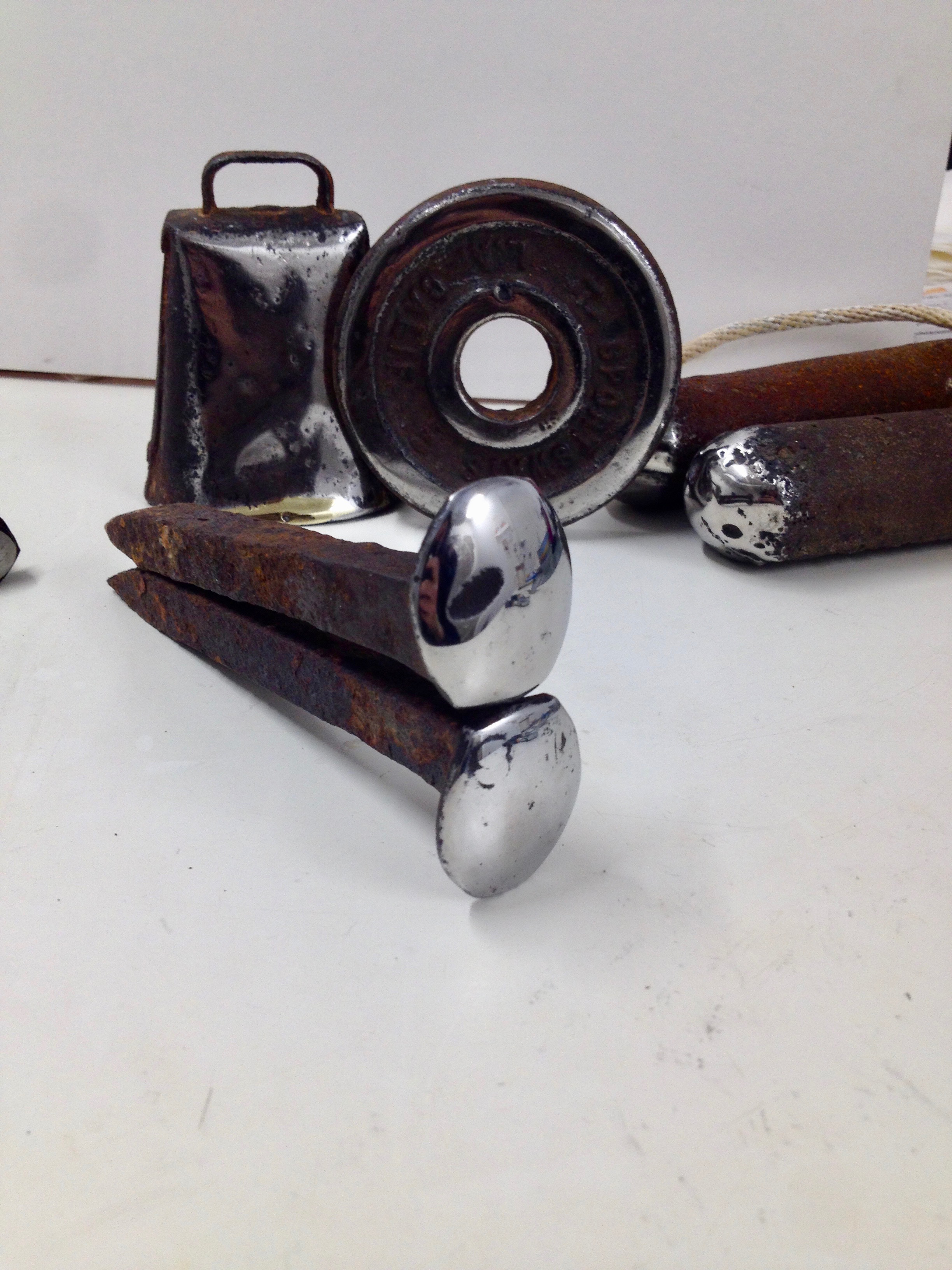 Combs’ polished rail spikes leaning against each other. Image courtesy of the author.