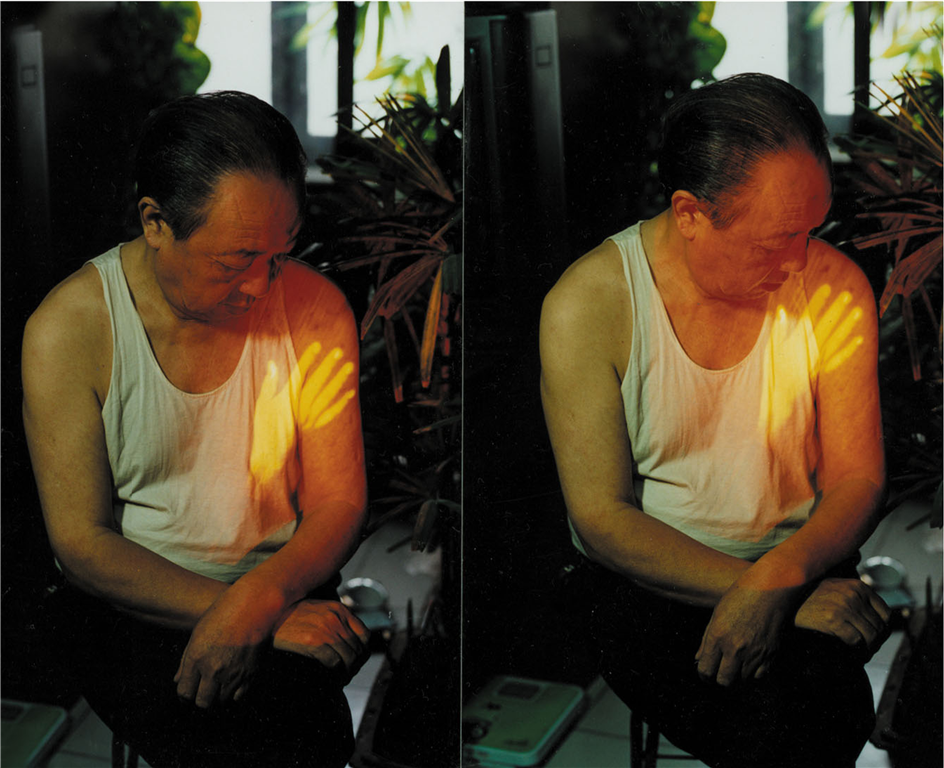 Song Dong, Touching My Father , 1997, Videotape, performance. Image accessed via Asia Art Archive.