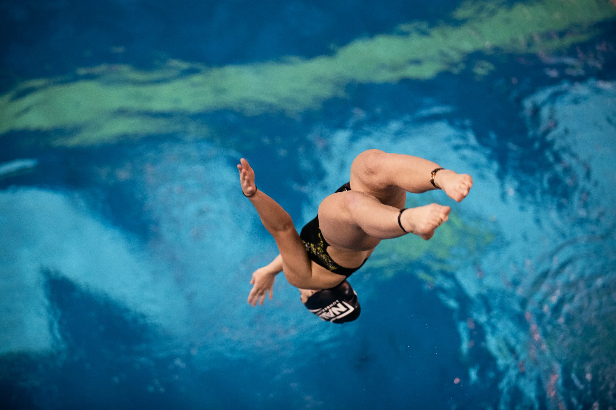 Northern Arizona University freshman Emily Sharrer twists and turns as she plummets from the 7.5-meter platform into the diving pool Oct. 29, 2018, at Wall Aquatic Center in Flagstaff, Ariz.