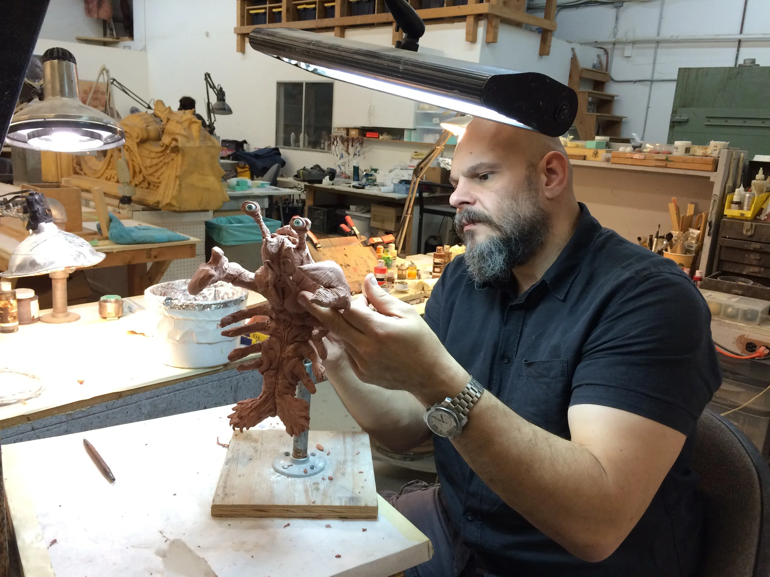 Gabe Bartalos hard at work sculpting the newborn creature puppet's design...