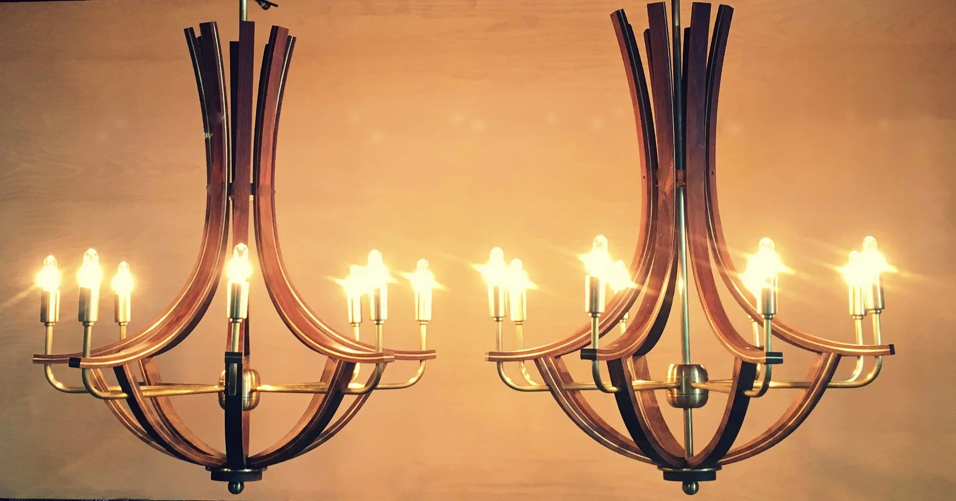 Walnut chandeliers inlayed with brass
