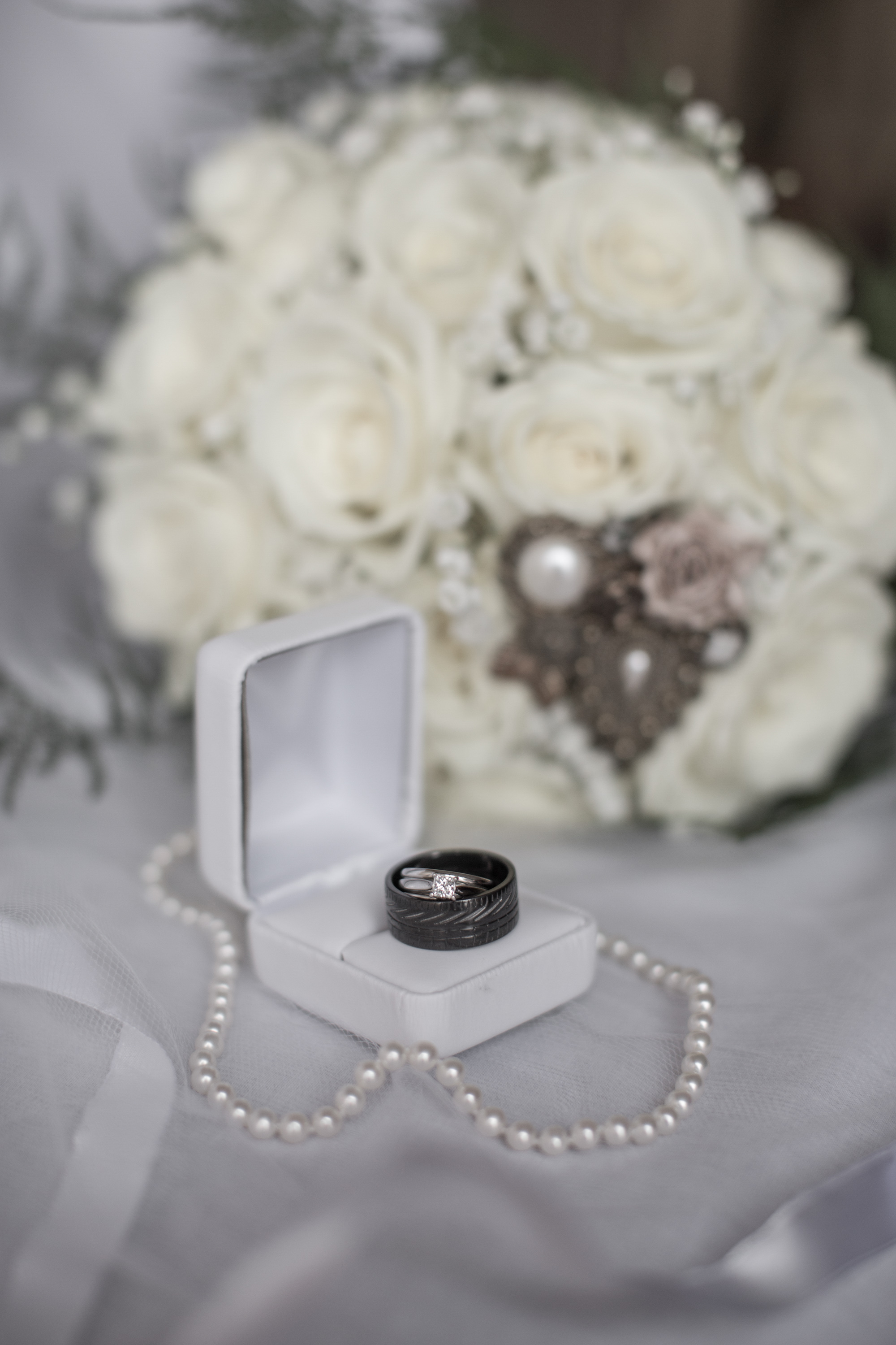  wedding-rings-with-bouquet-and-necklace 